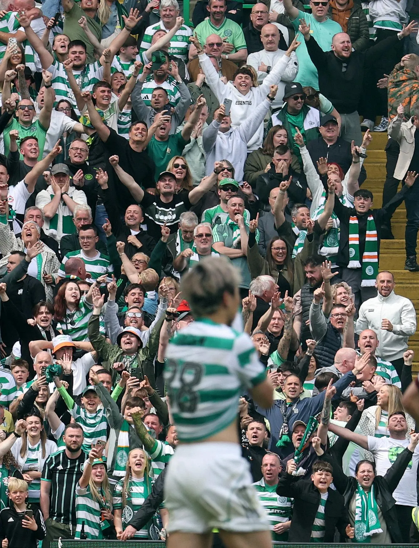 Celtic fans celebrate Daizen Maeda scoring their second goal.