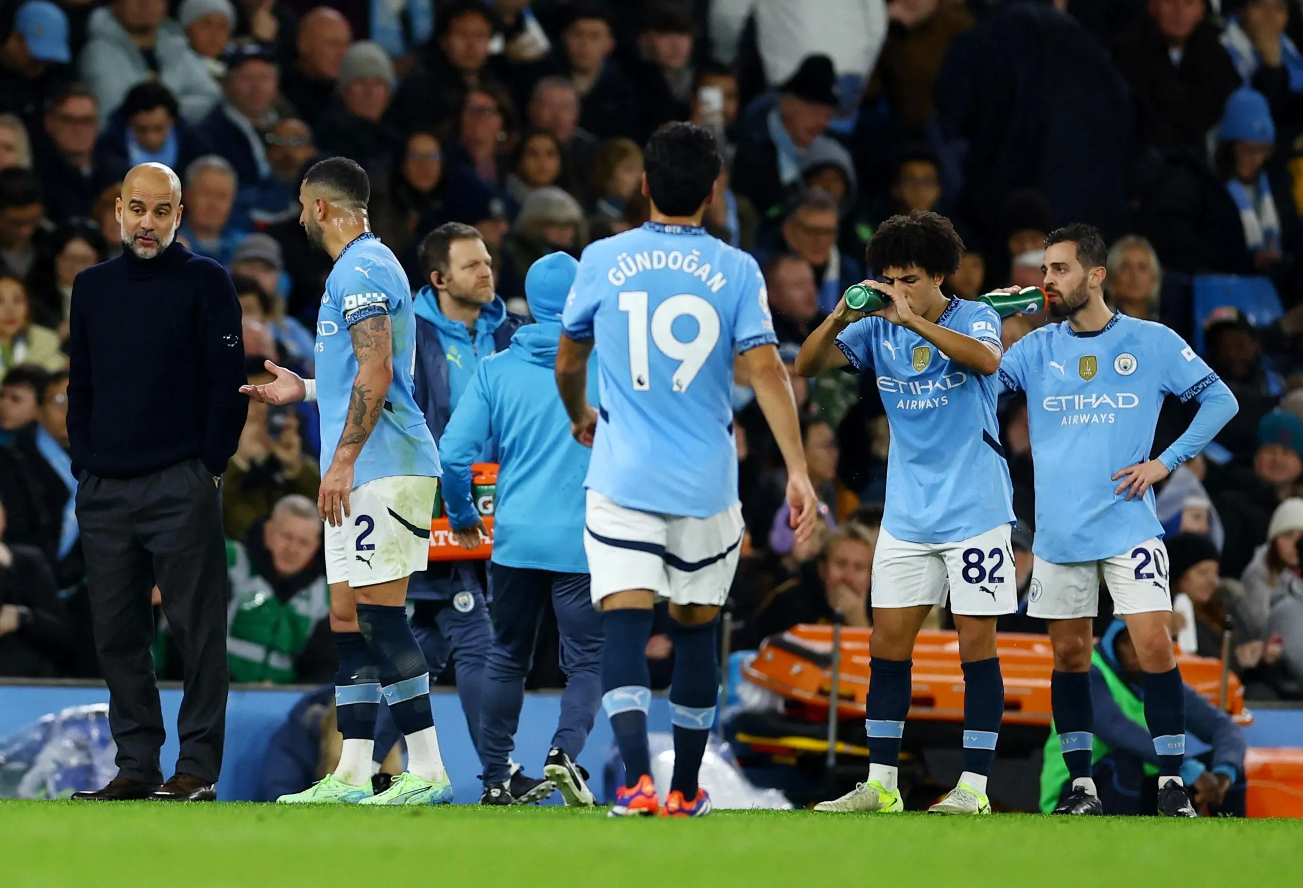 Pep Guardiola speaking to Kyle Walker in a break in play when Manchester City played Spurs in November 2024. The two clashed when Walker was captain.