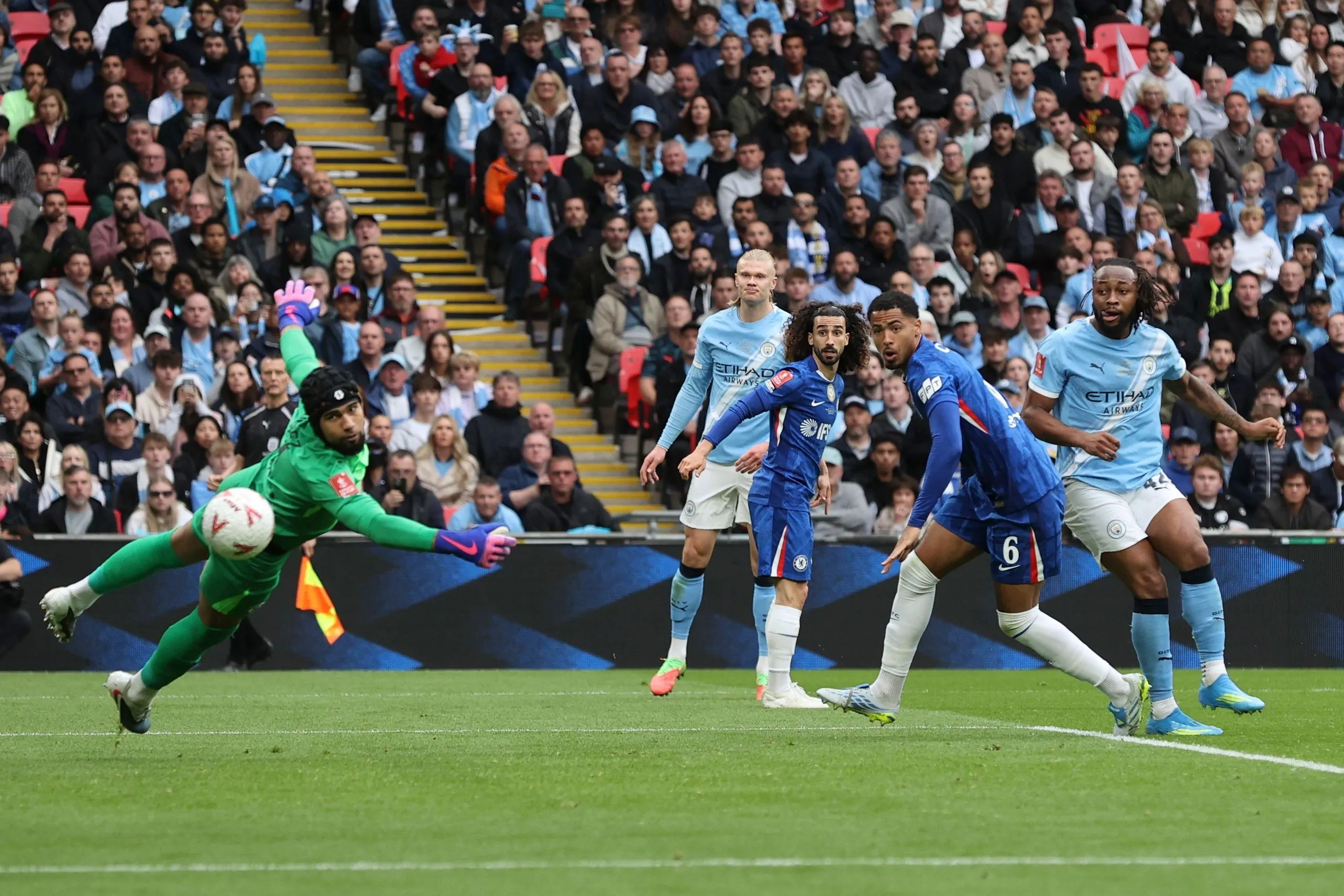 Antoine Semenyo watches the ball fly past Robert Sánchez.