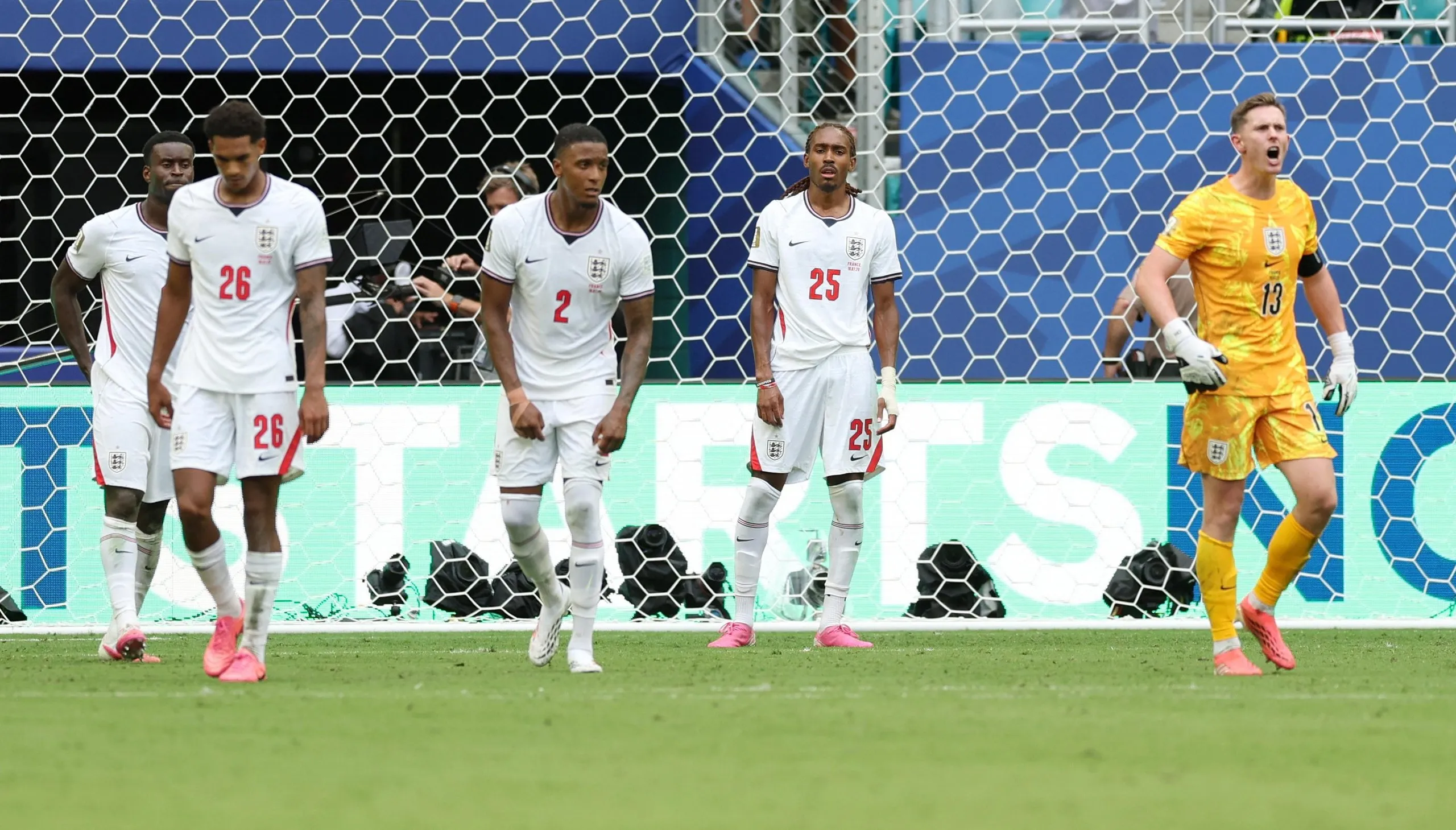 England's Dean Henderson (right), Djed Spence (second right) and teammates look dejected after France's Bradley Barcola scores their second goal.