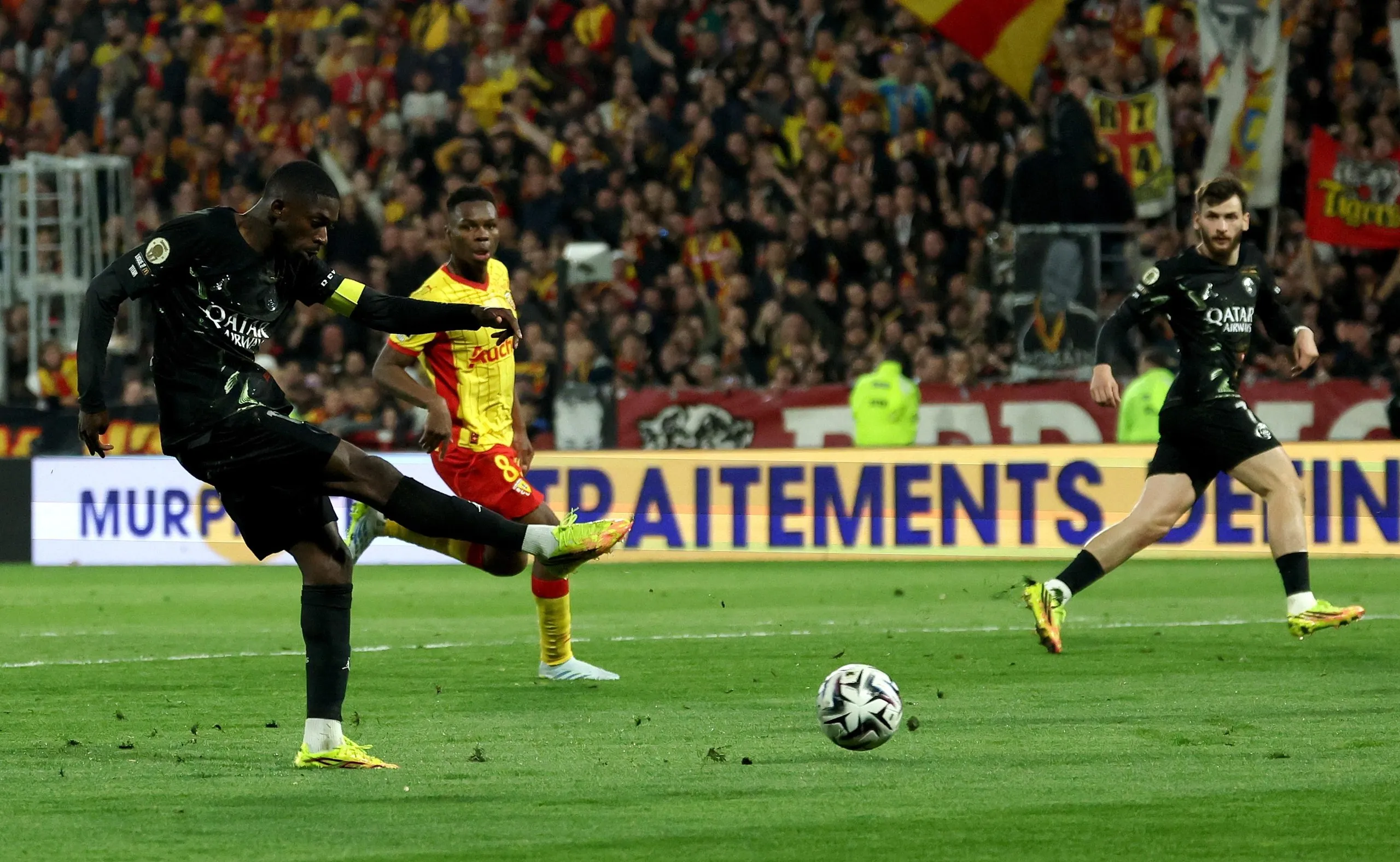 Ousmane Dembélé shoots. 