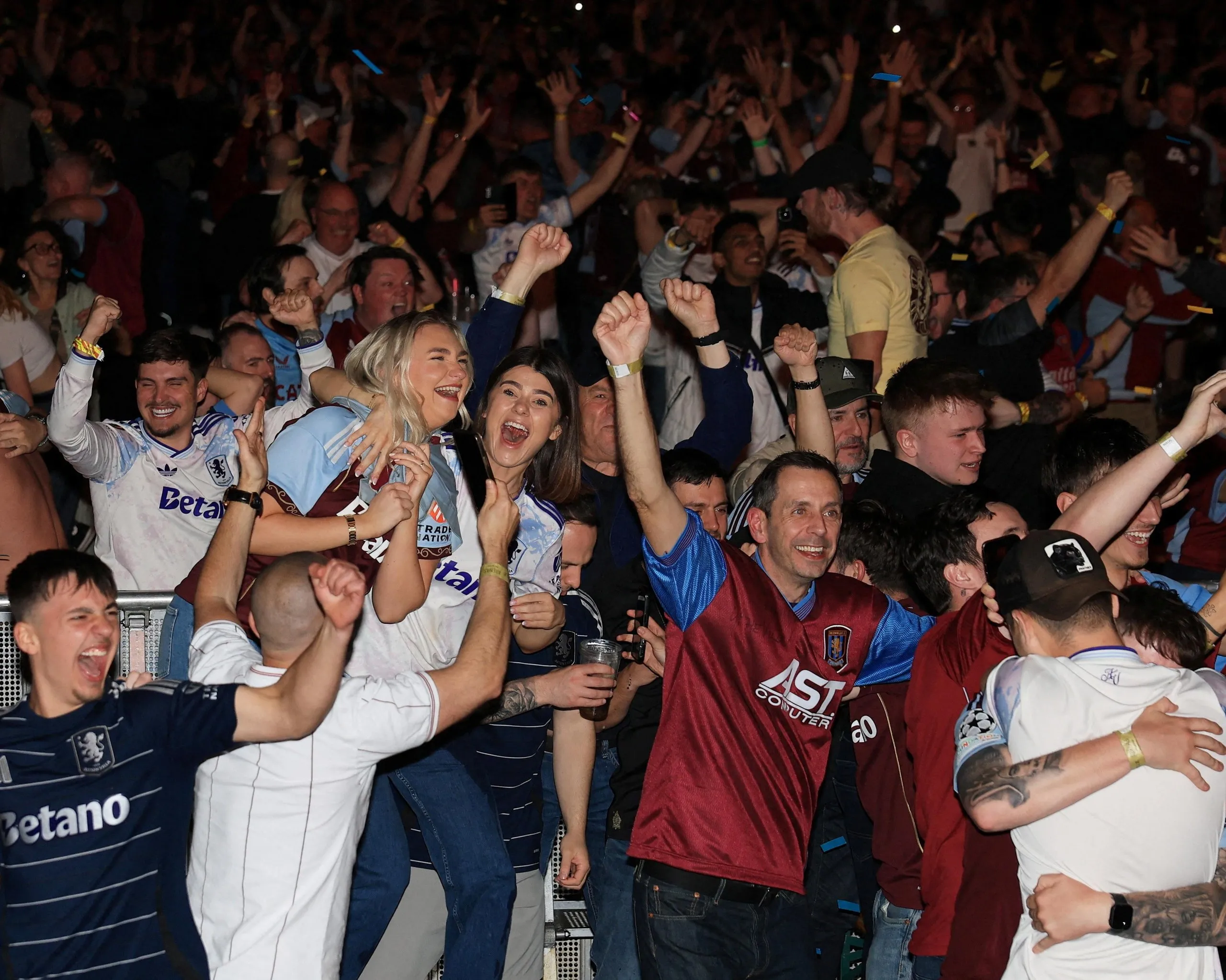 Aston Villa fans celebrate after watching the game on a big screen at Birmingham’s Utilita Arena.
