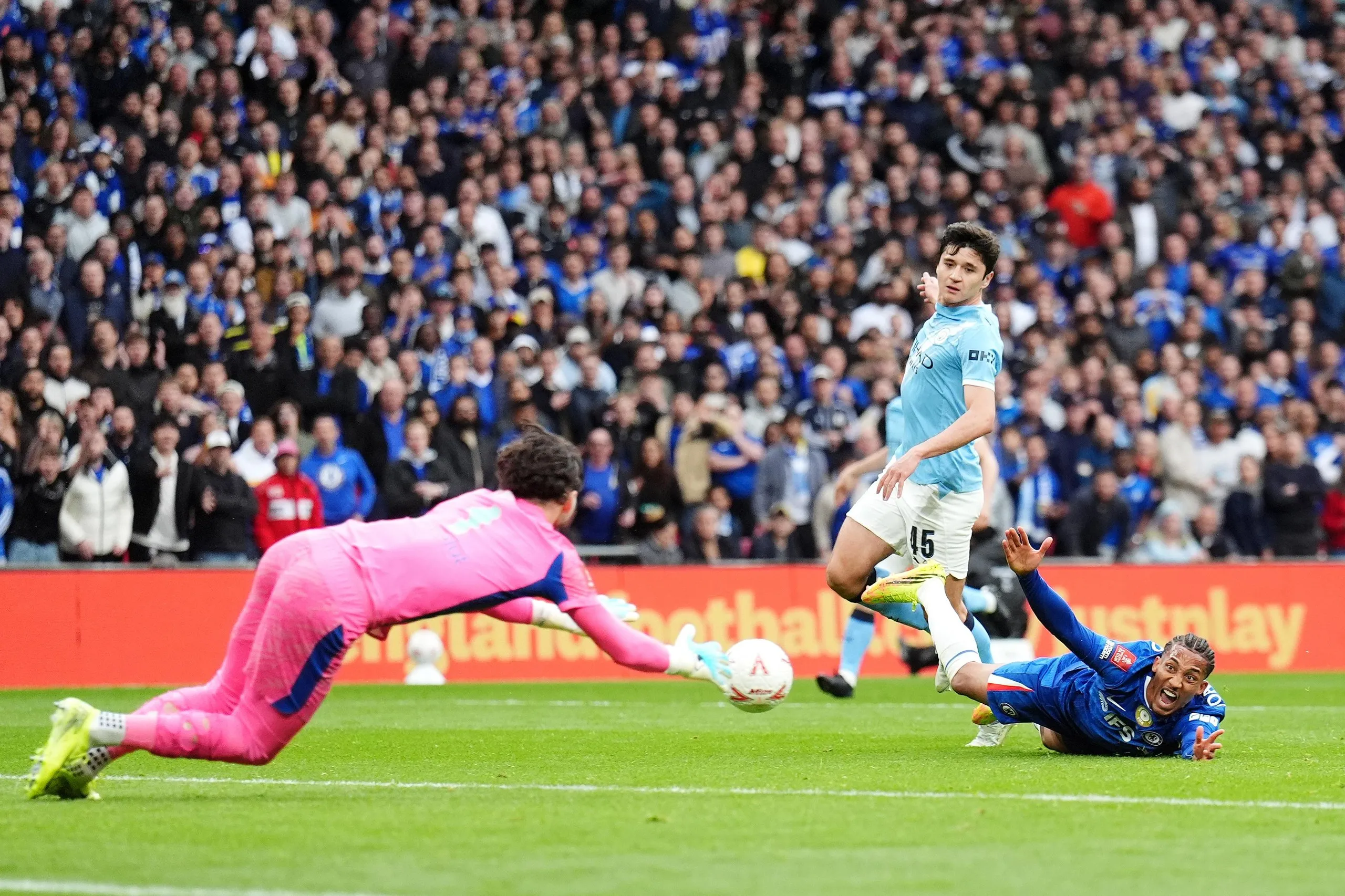 Chelsea's Joao Pedro (right) reacts as he does down in the penalty area again.