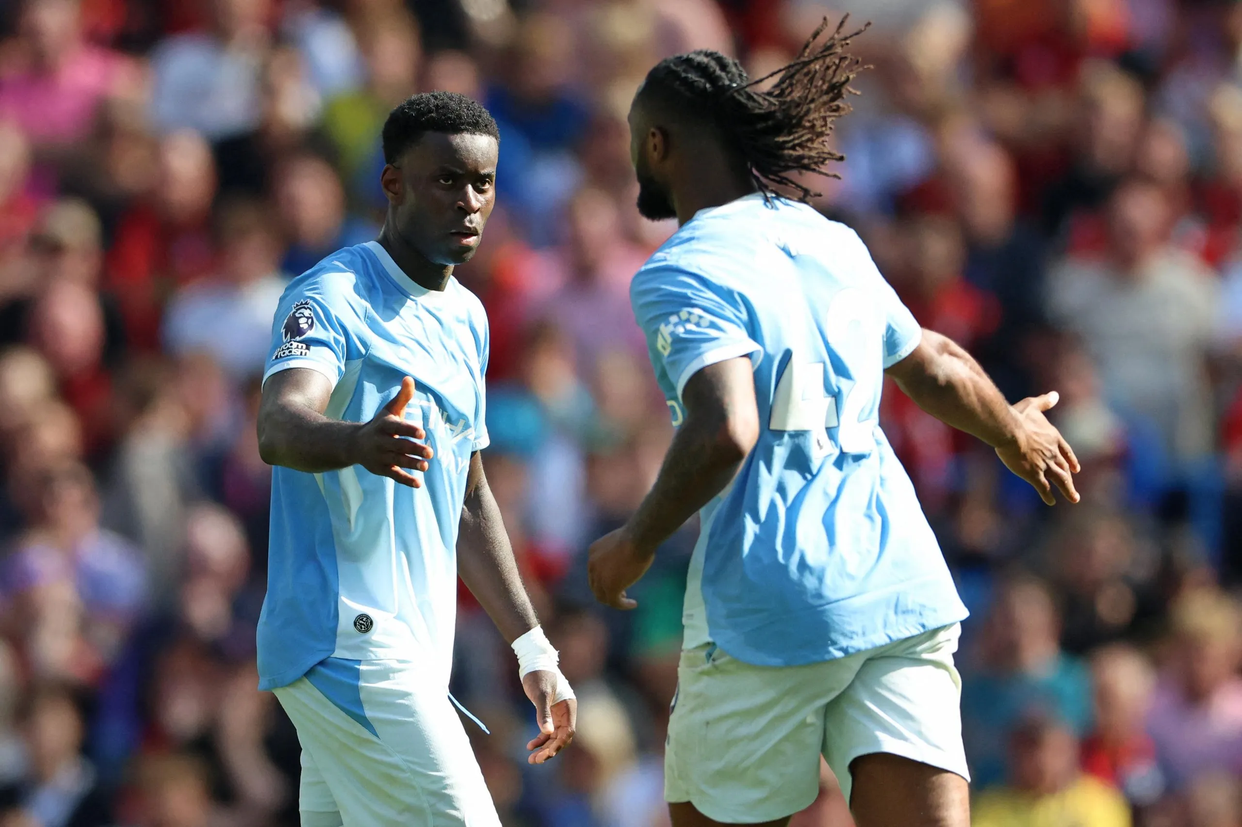 Guehi (L) celebrates with Antoine Semenyo.
