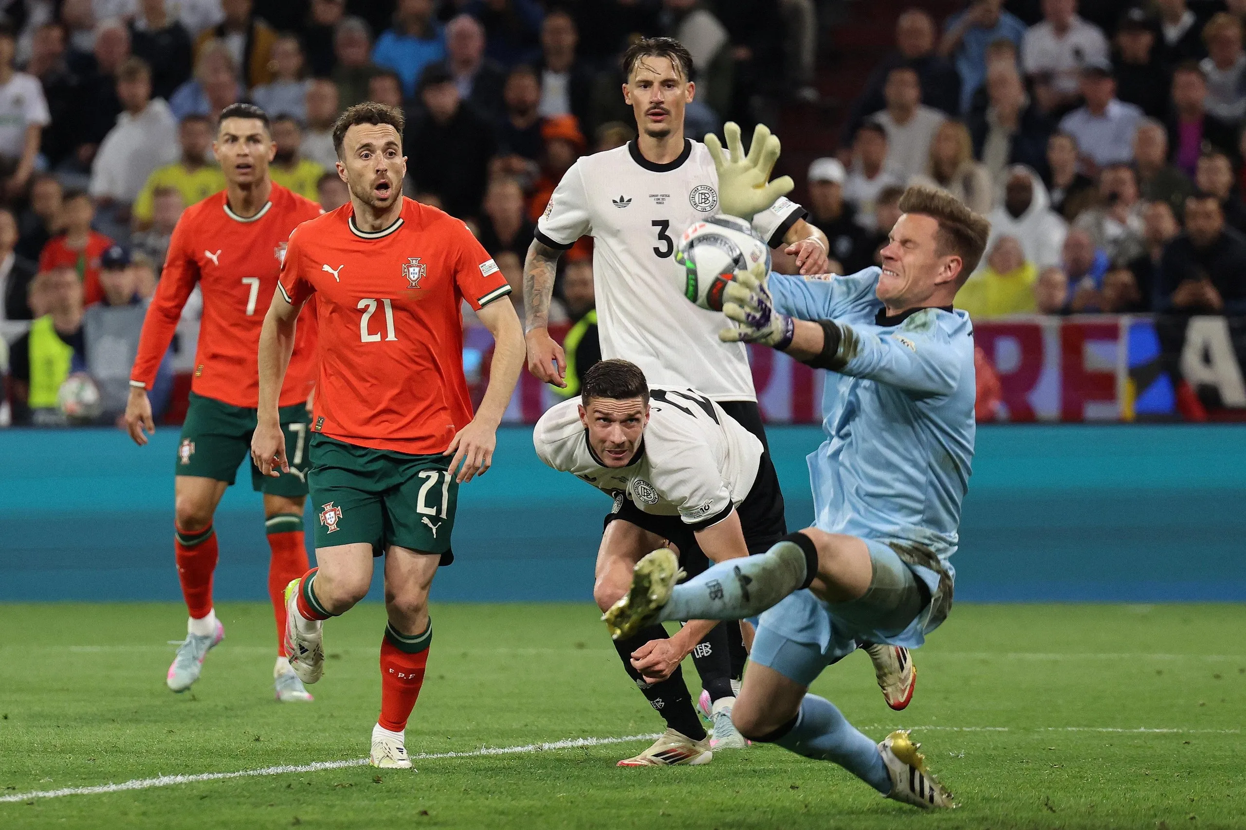 Germany’s goalkeeper Marc-Andre Ter Stegen saves from Portugal’s Francisco Conceicao.