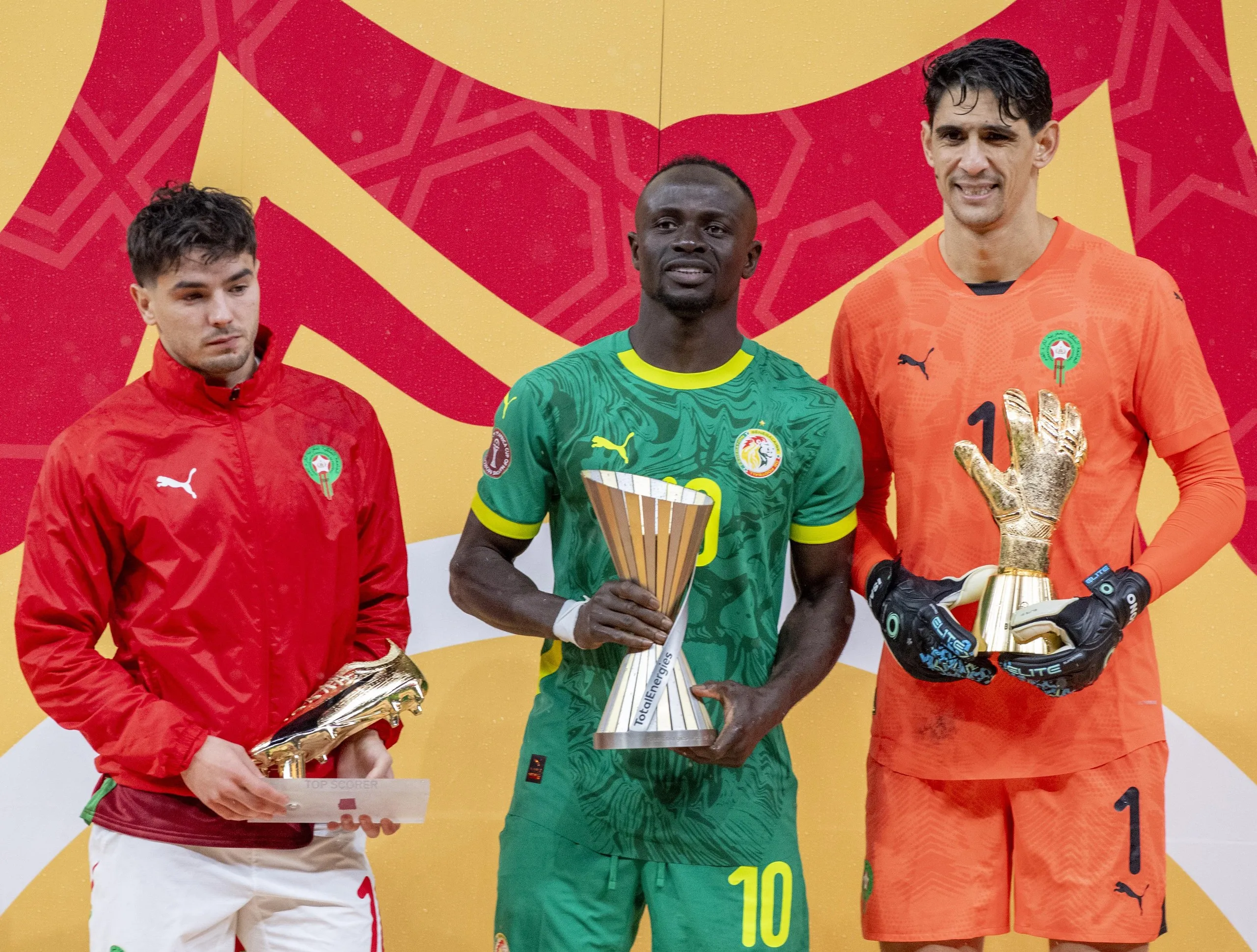 Brahim Díaz holds the golden boot award, Sadio Mané holds the tournament’s best player award and Yassine Bounou holds the tournament’s best goalkeeper award after the Afcon final match between Senegal and Morocco