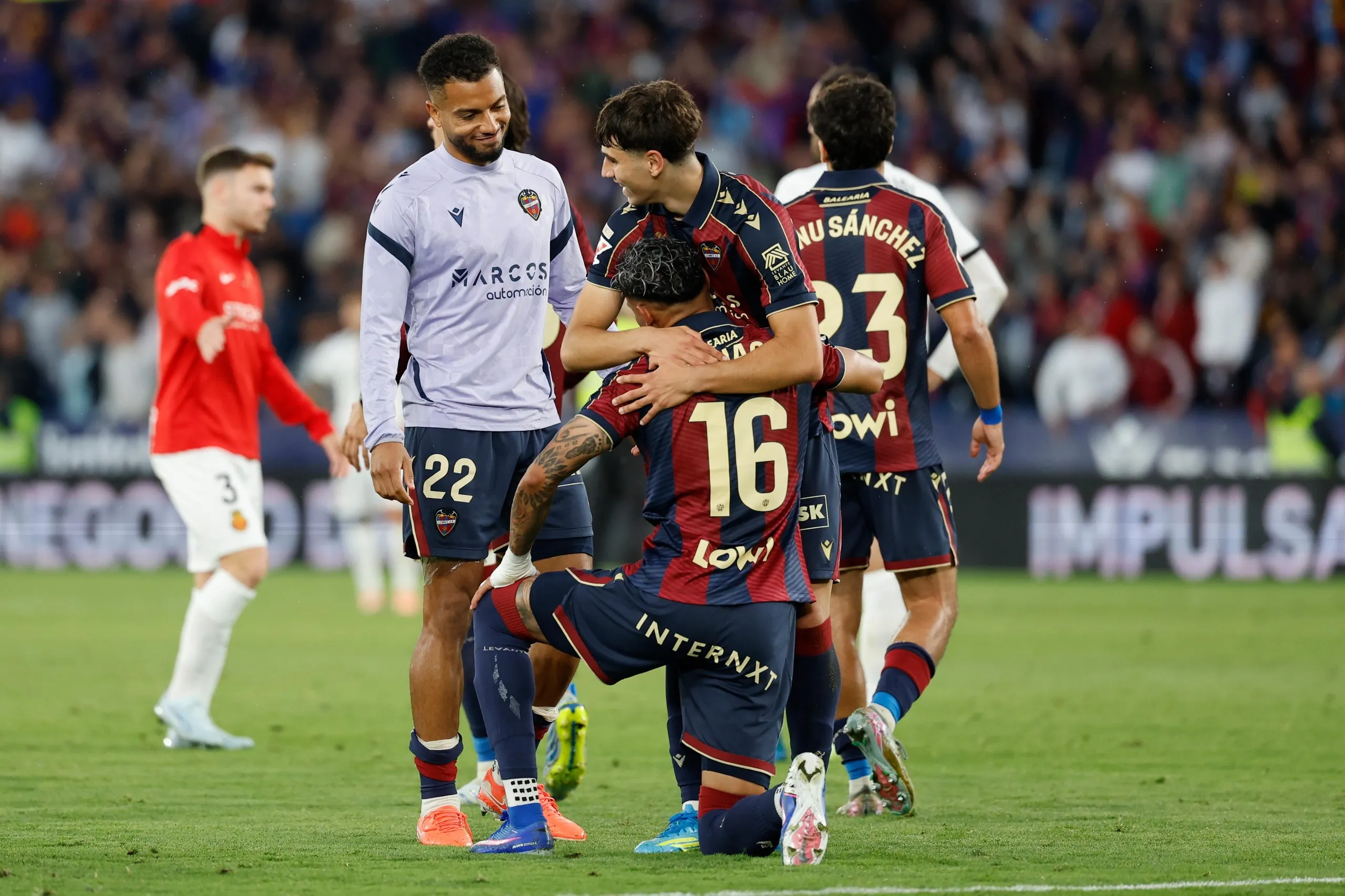Levante players celebrate at the final whistle of their crucial win against Mallorca