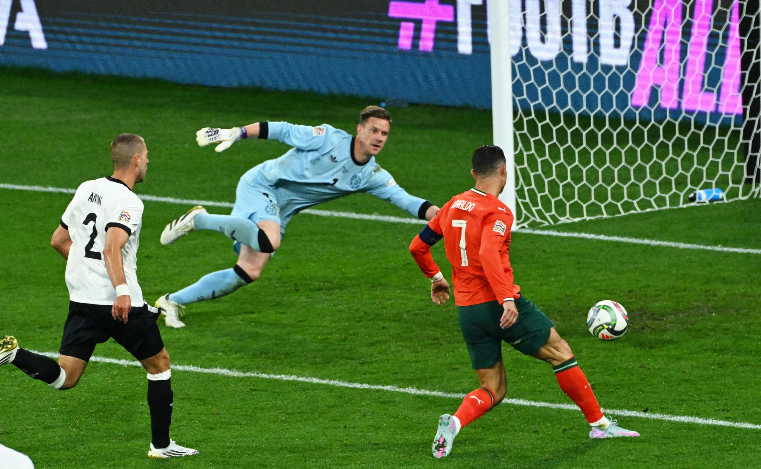Cristiano Ronaldo slots home from close range to give Portugal the lead.