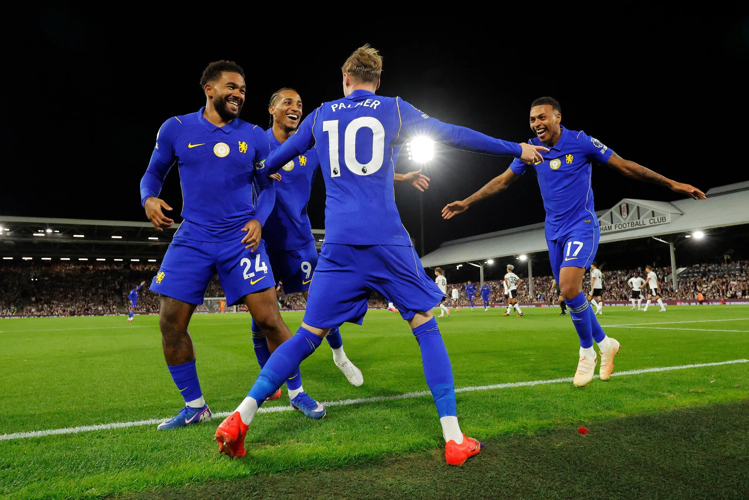 Palmer celebrates with Joao Pedro and Morgan Rogers.