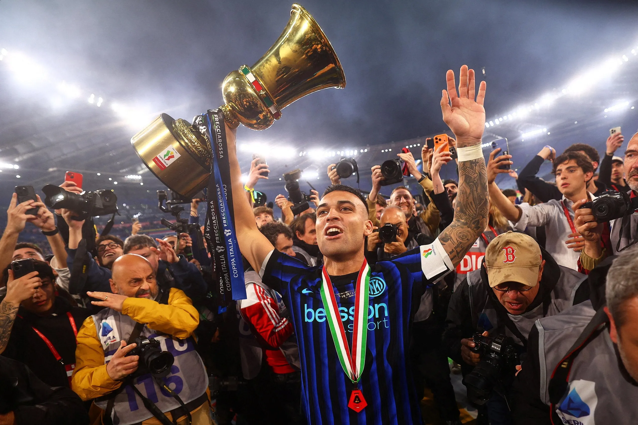 Lautaro Martínez holds the Coppa Italia aloft after Inter’s triumph against Lazio