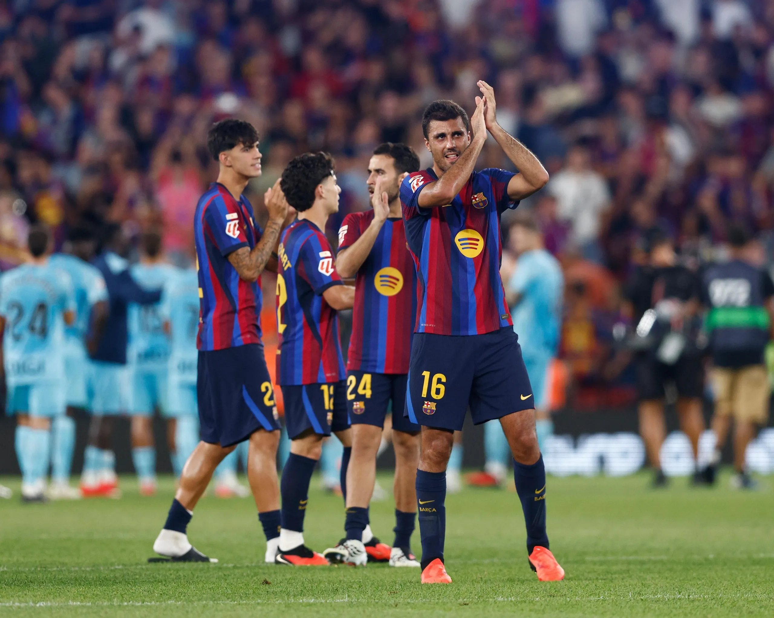 Barcelona midfielder Rodri applauds the Camp Nou crowd after making his debut.