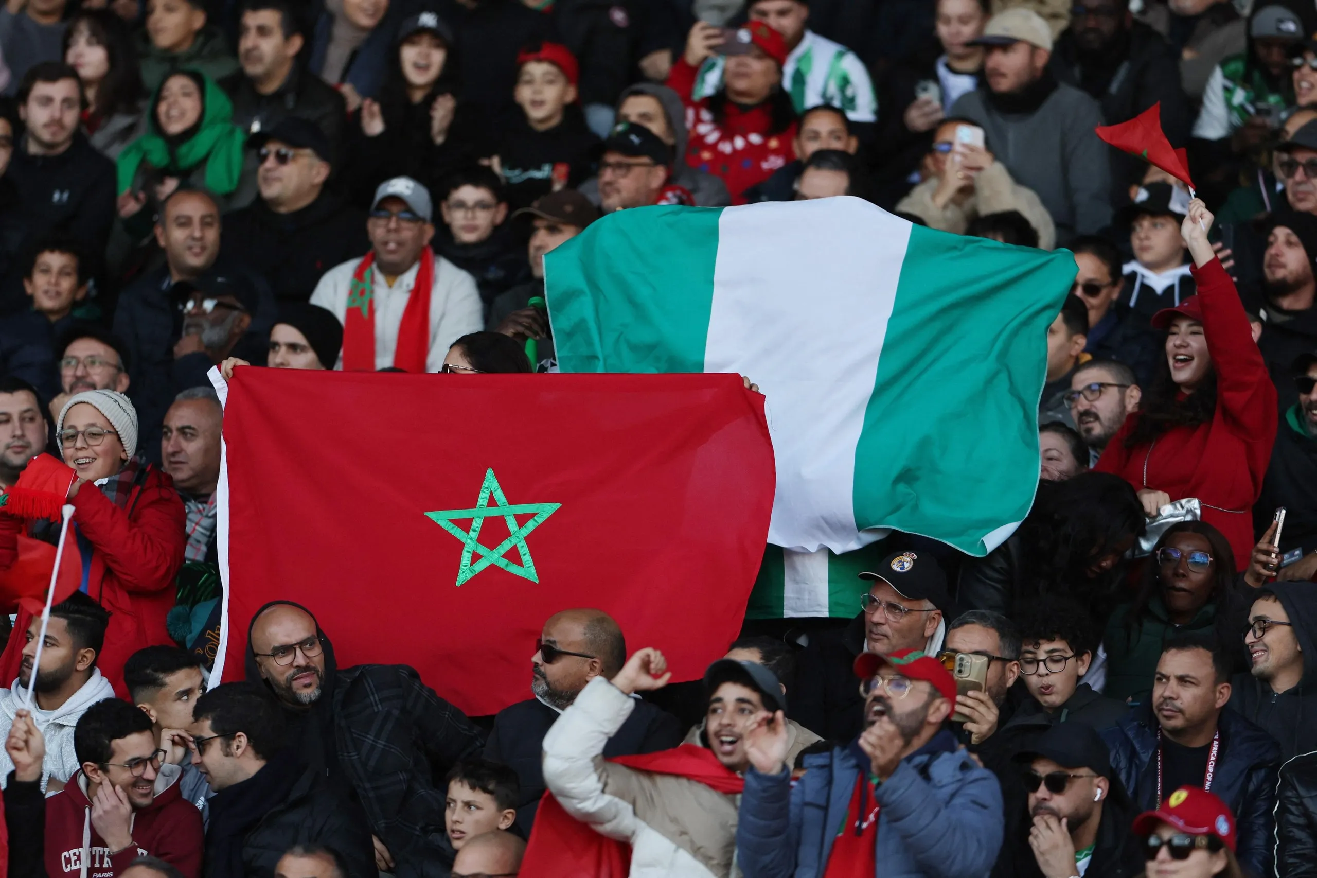 Fans holding up flags in the stands