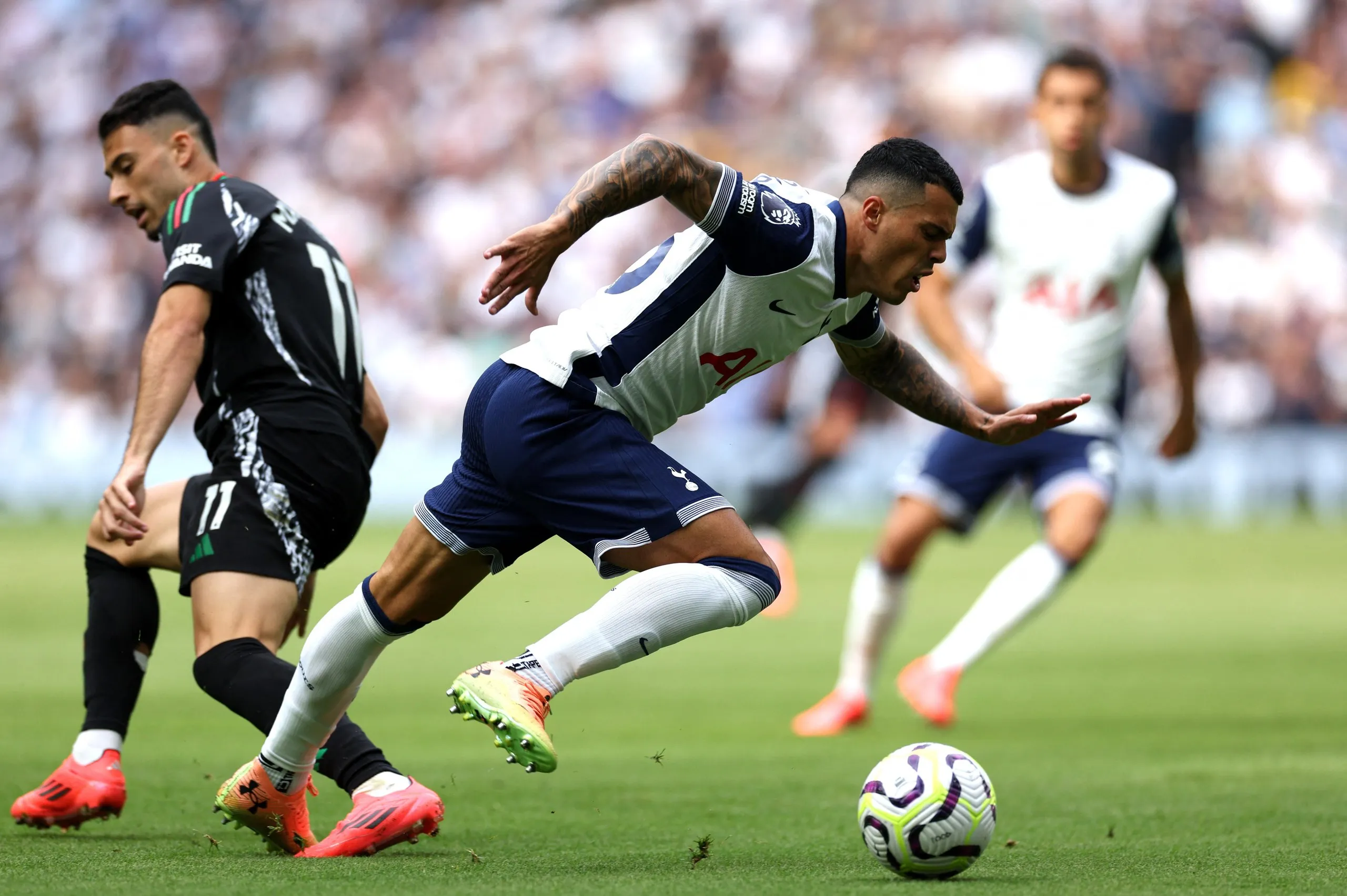 Pedro Porro takes the ball away from Gabriel Martinelli during last season’s north London derby at the Tottenham Hotspur Stadium. The hosts lost the game 1-0