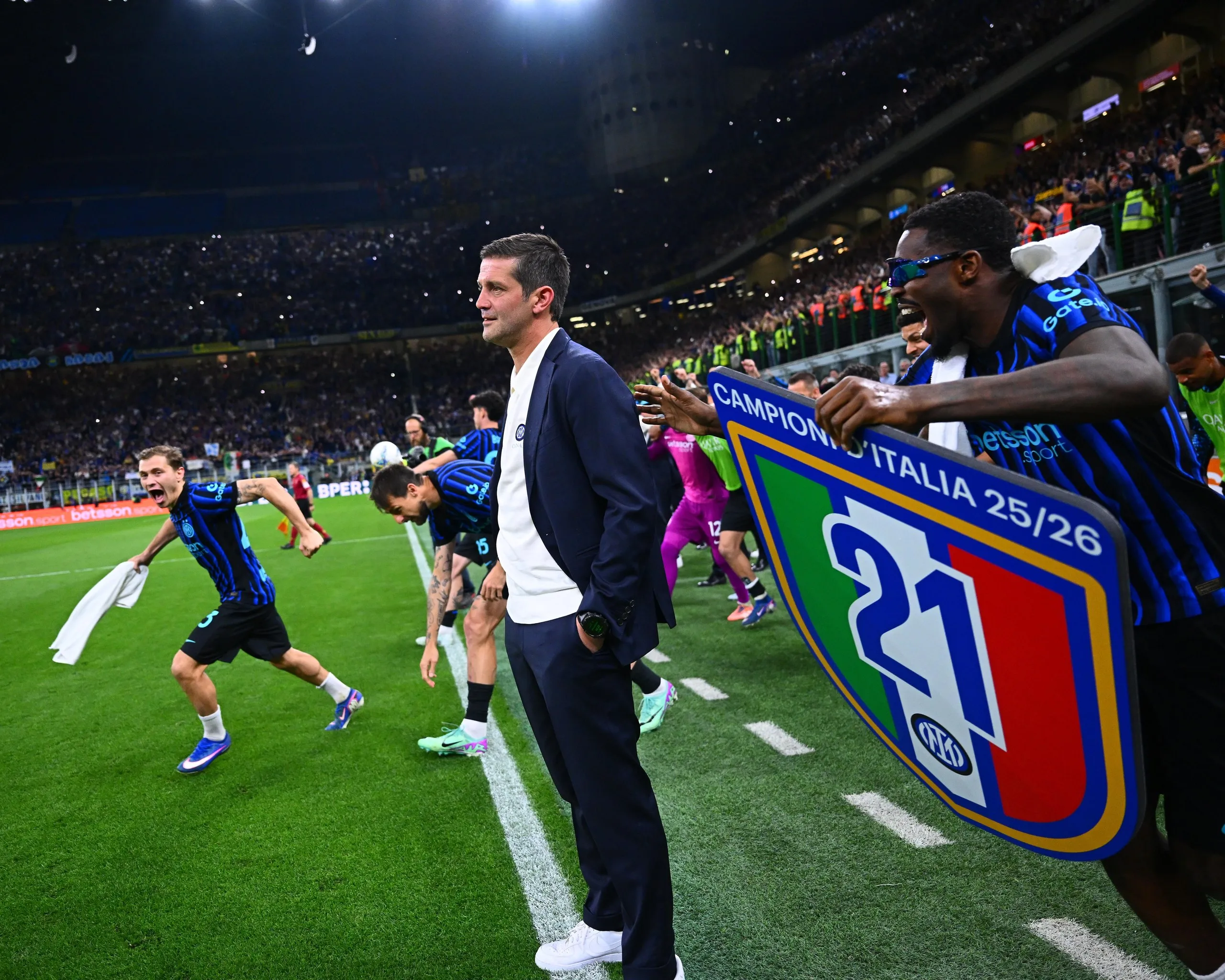 Cristian Chivu is a picture of calm as his Inter players celebrate winning the Serie A title, the club’s 21st Scudetto