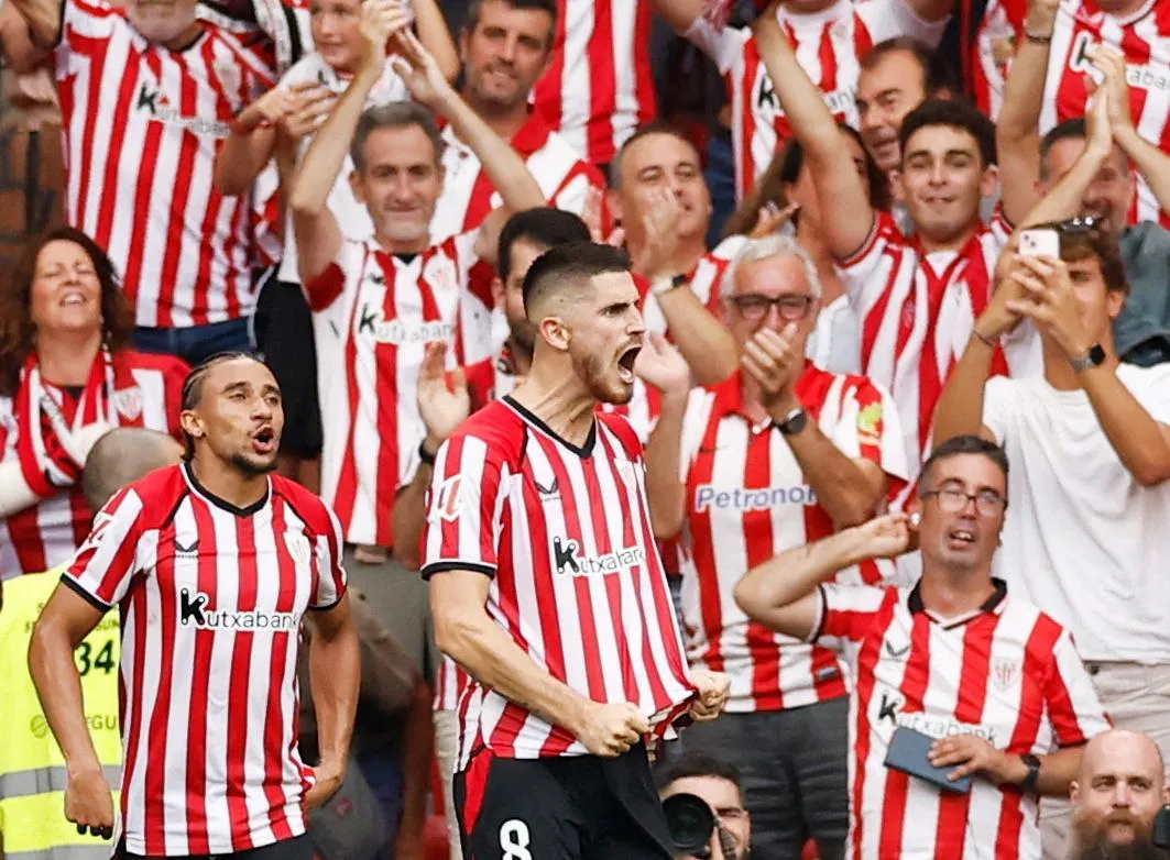 Oihan Sancet roars with delight after scoring Bilbao’s third goal as happy fans watch on
