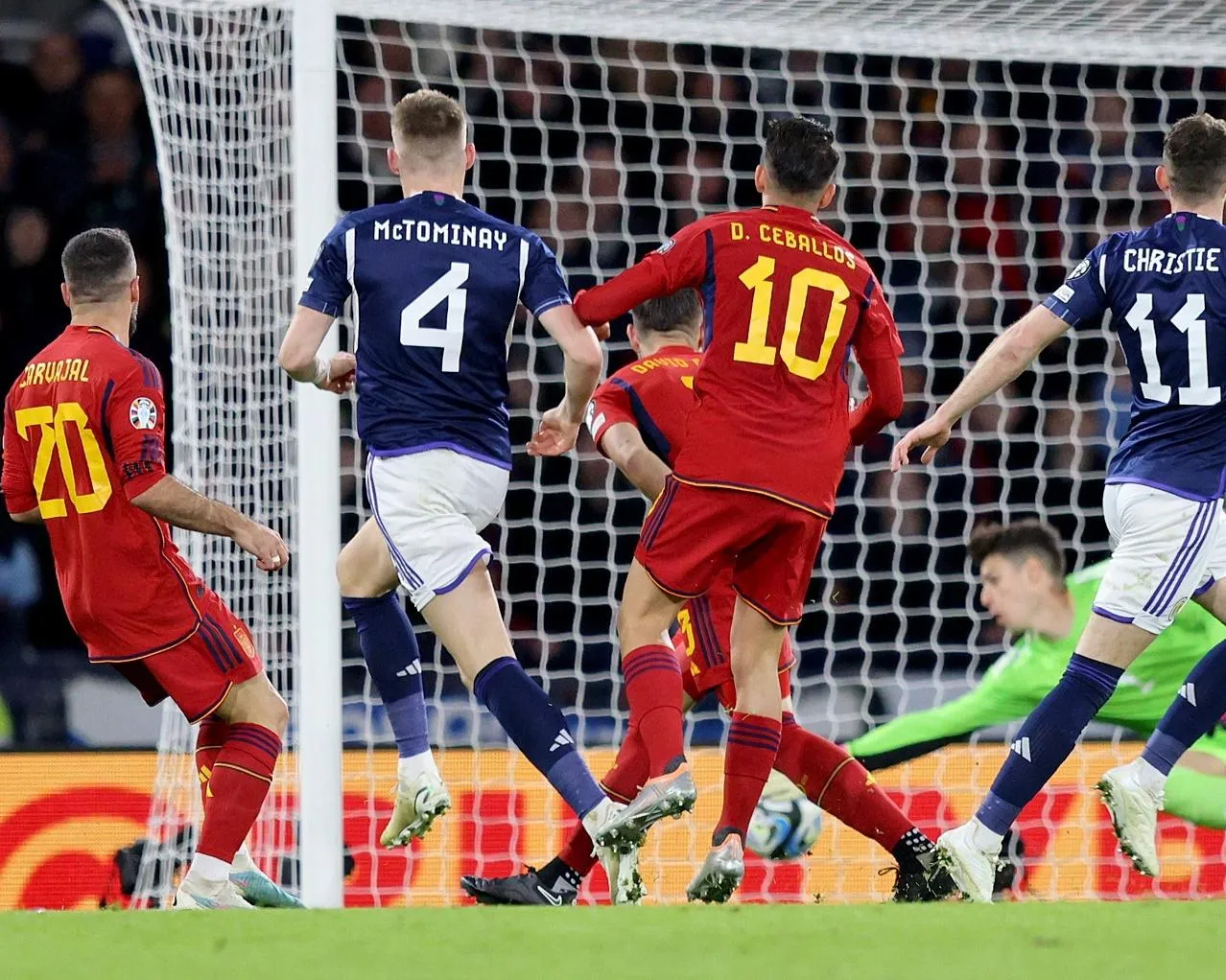 The Scotland midfielder Scott McTominay looks on as his shot beats the Spain goalkeeper, Kepa Arrizabalaga, during Scotland's 2-0 win in Euro 2024 qualifiying at Hampden Park.