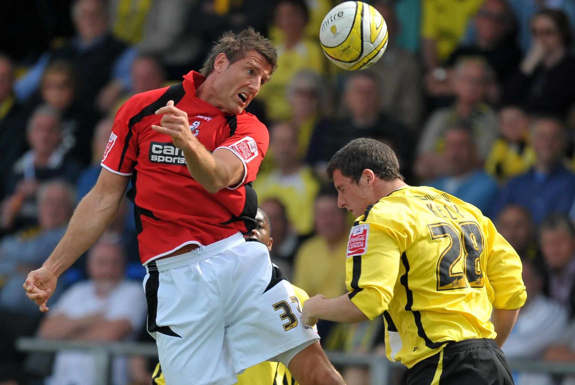 Bournemouth’s Steve Fletcher and Burton’s Shaun Kelly battle for the ball in a League Two match in 2010
