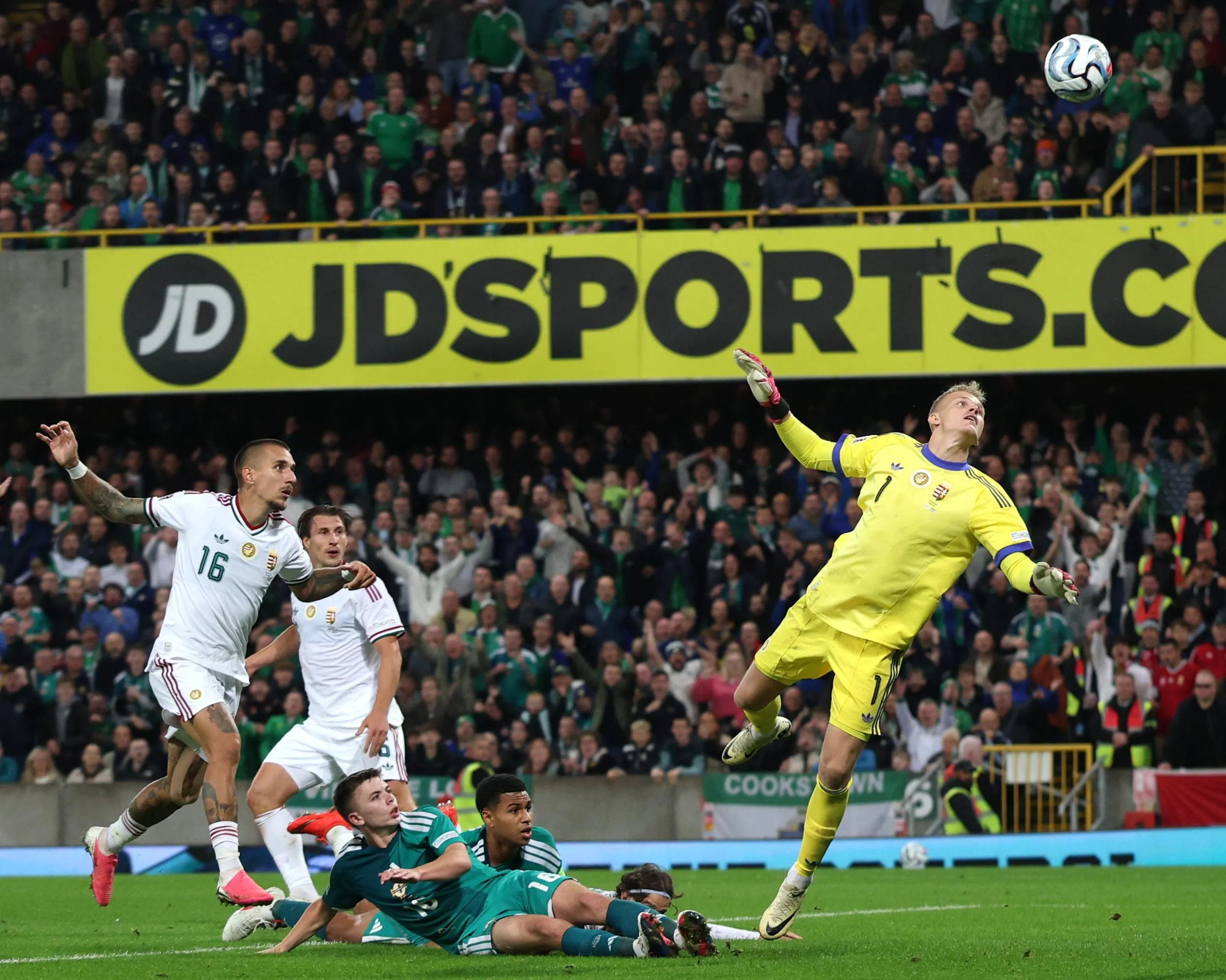 Northern Ireland’s Patrick Kelly lobs the Hungary goalkeeper.