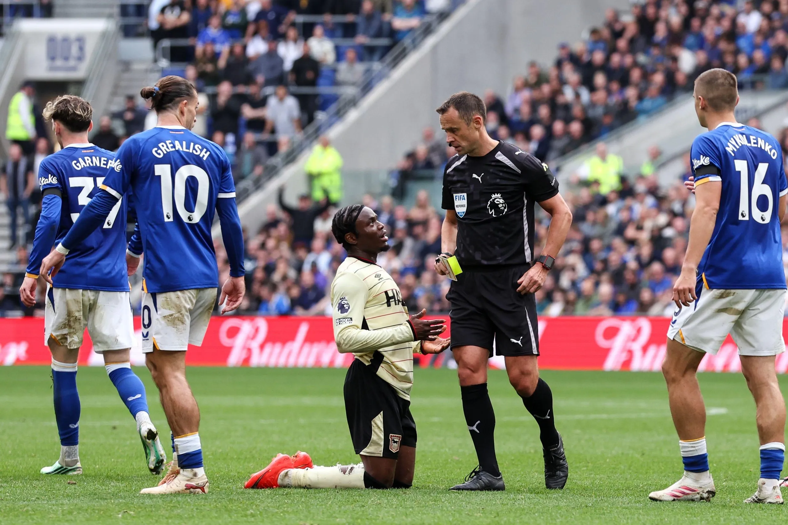 Stuart Attwell shows Ipswich Town’s Abdul Fatawu a second yellow card for simulation.