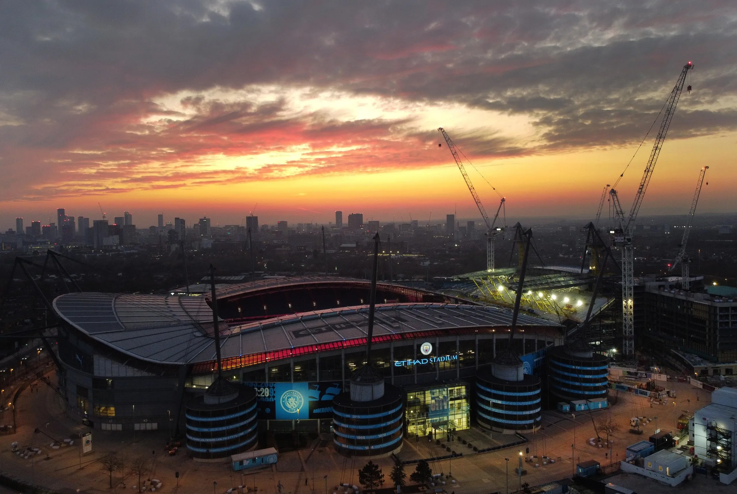 The sun sets over the Etihad Stadium