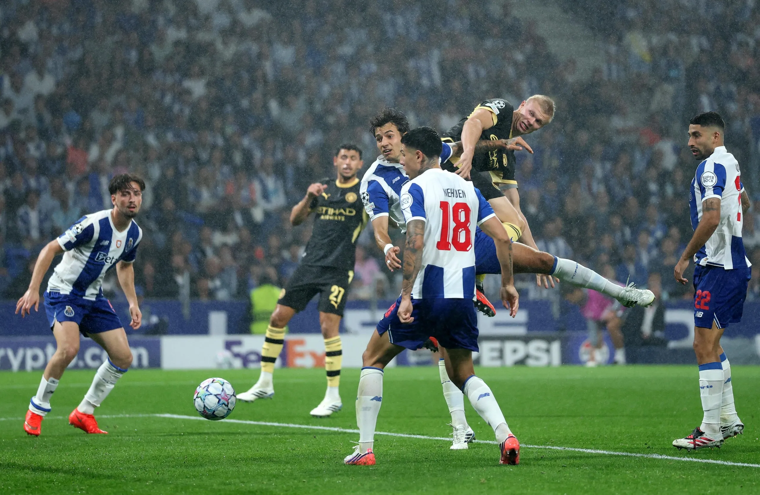 Erling Haaland heads home to open the scoring at Porto.