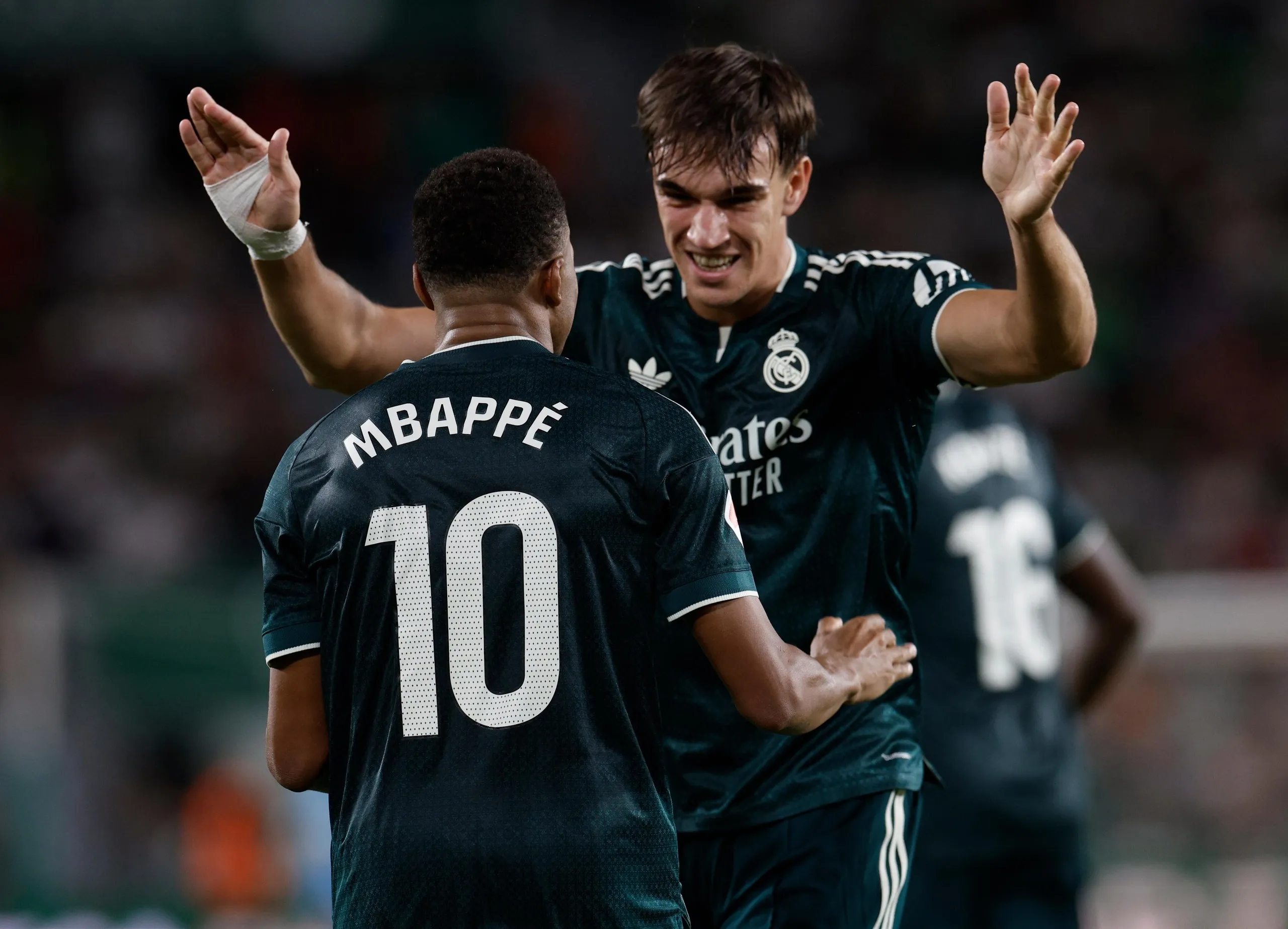 Carlos Espí and Kylian Mbappé celebrate during La Liga match between Elche and Real Madrid