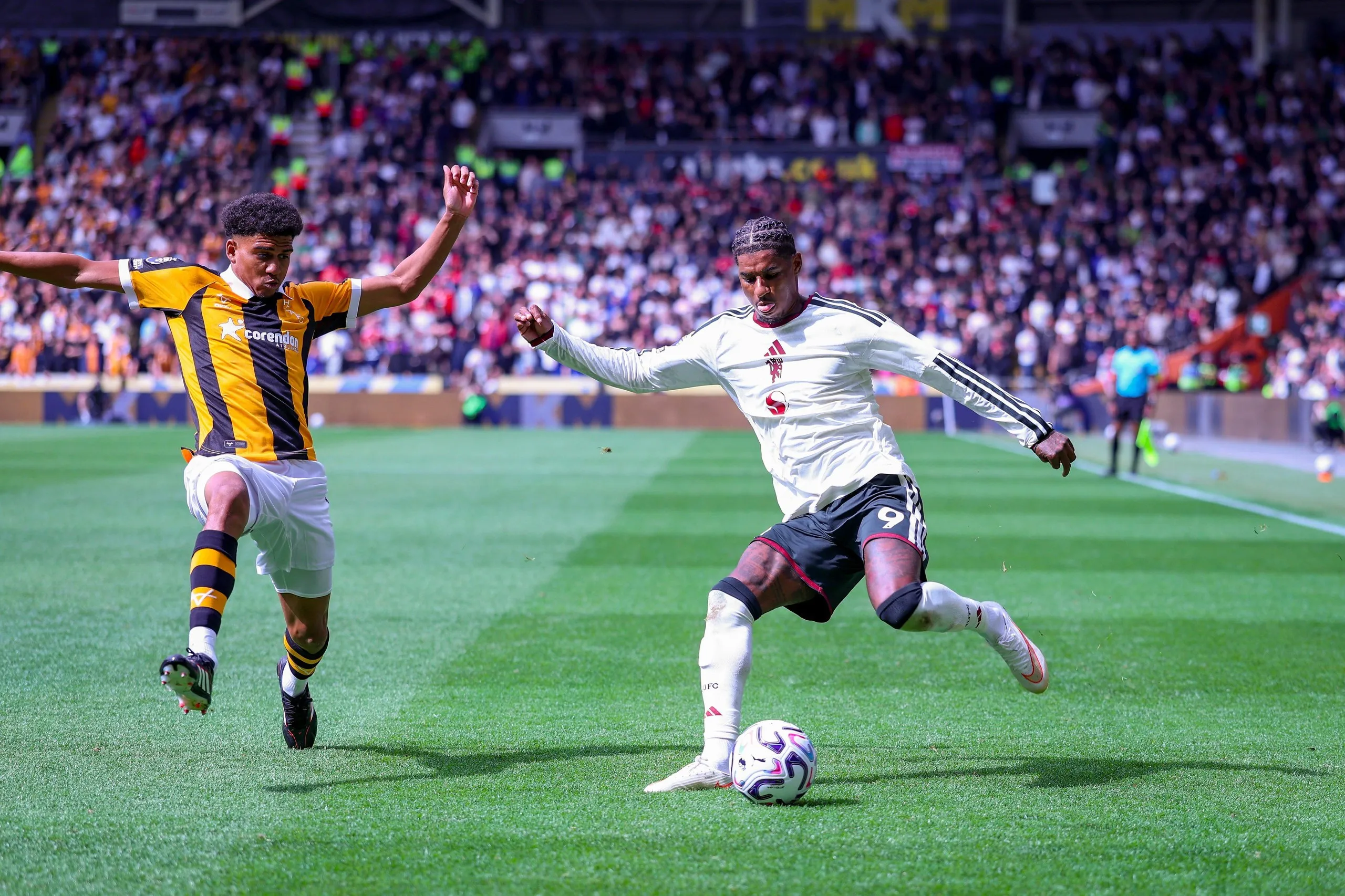 Herrington keeps Marcus Rashford in check on the opening Premier League day of the season.