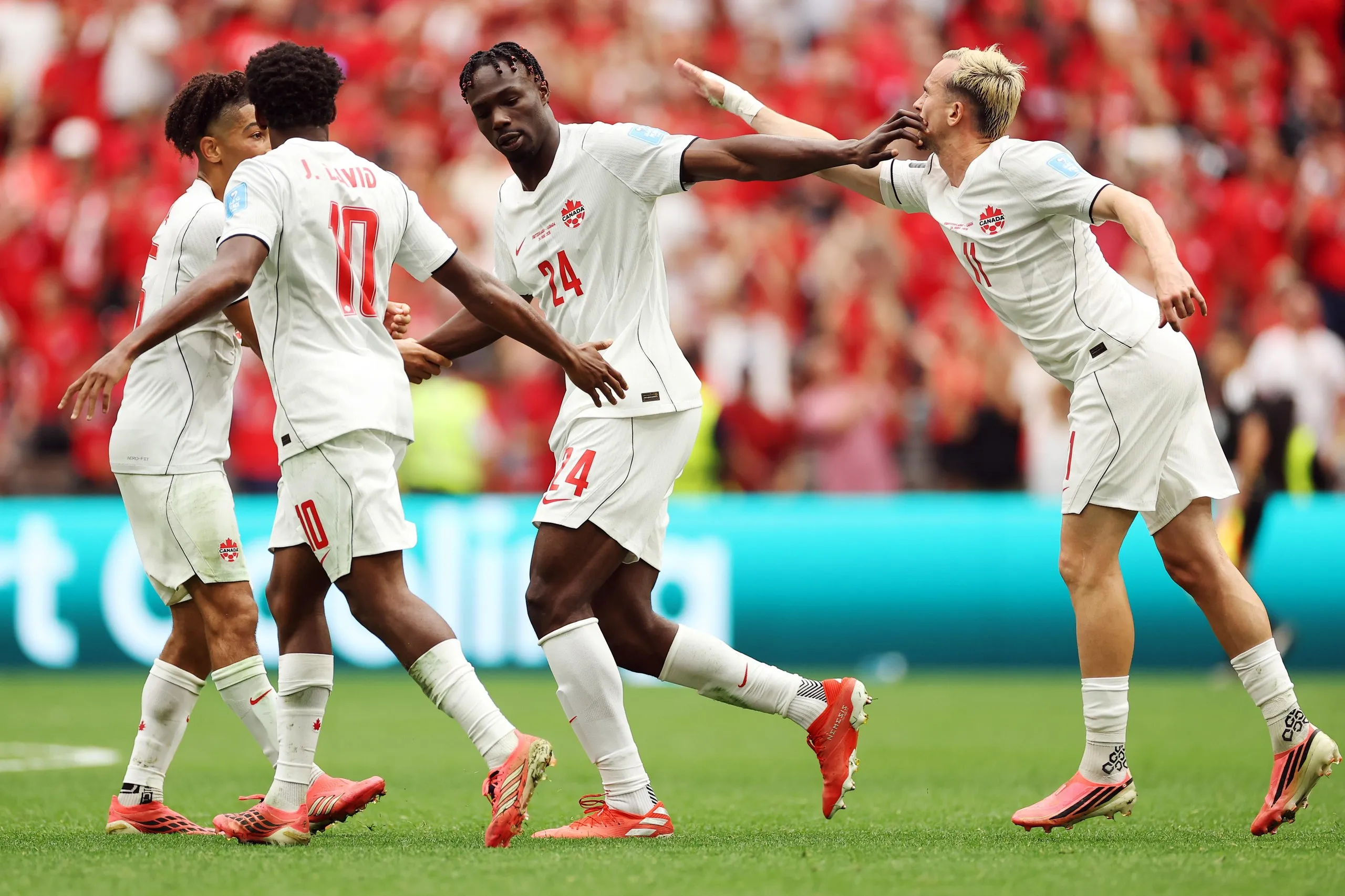 Promise David celebrates after scoring Canada's first goal against Switzerland.