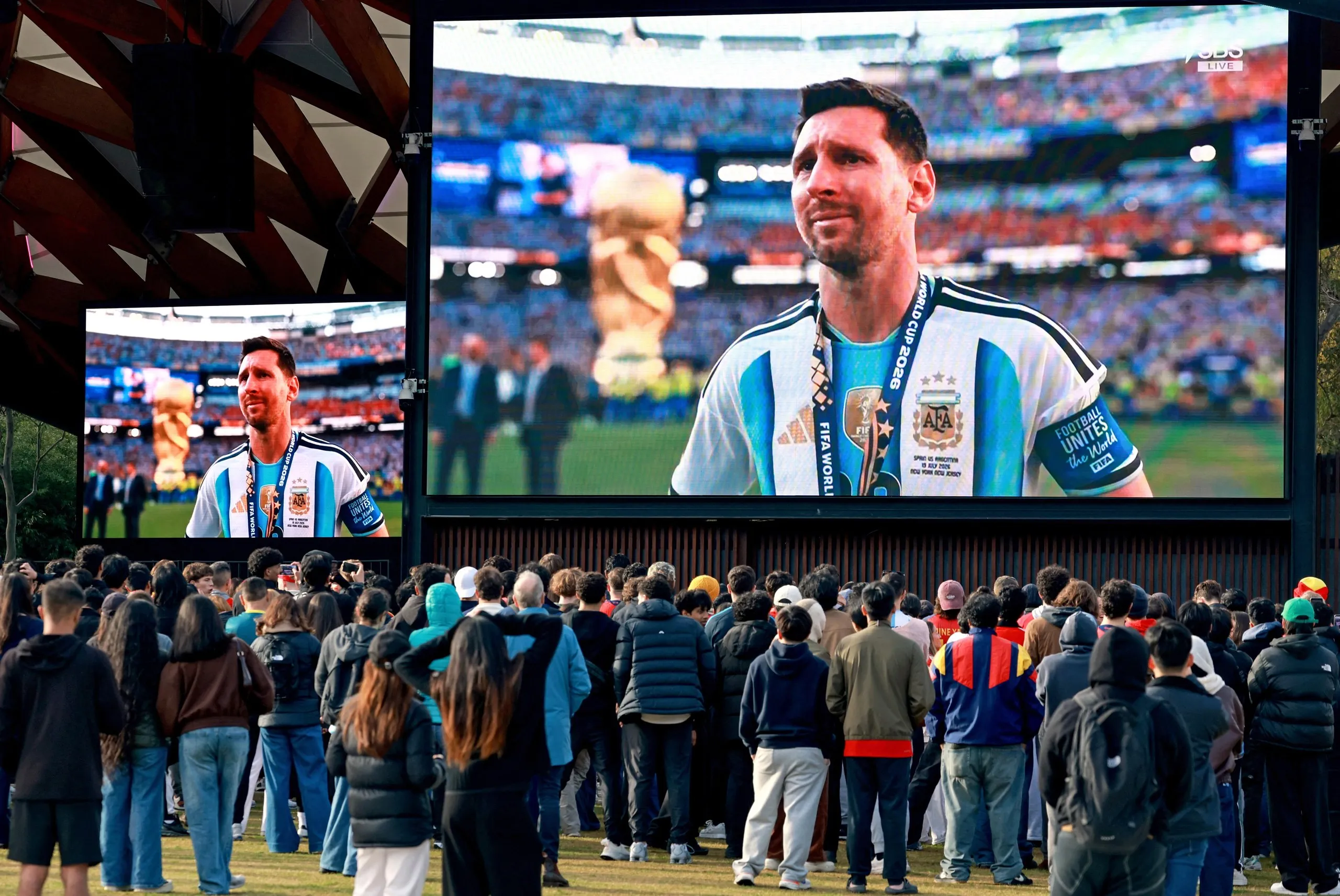 Supporters in Sydney, Australia, watch Messi crying on giant TV screens 