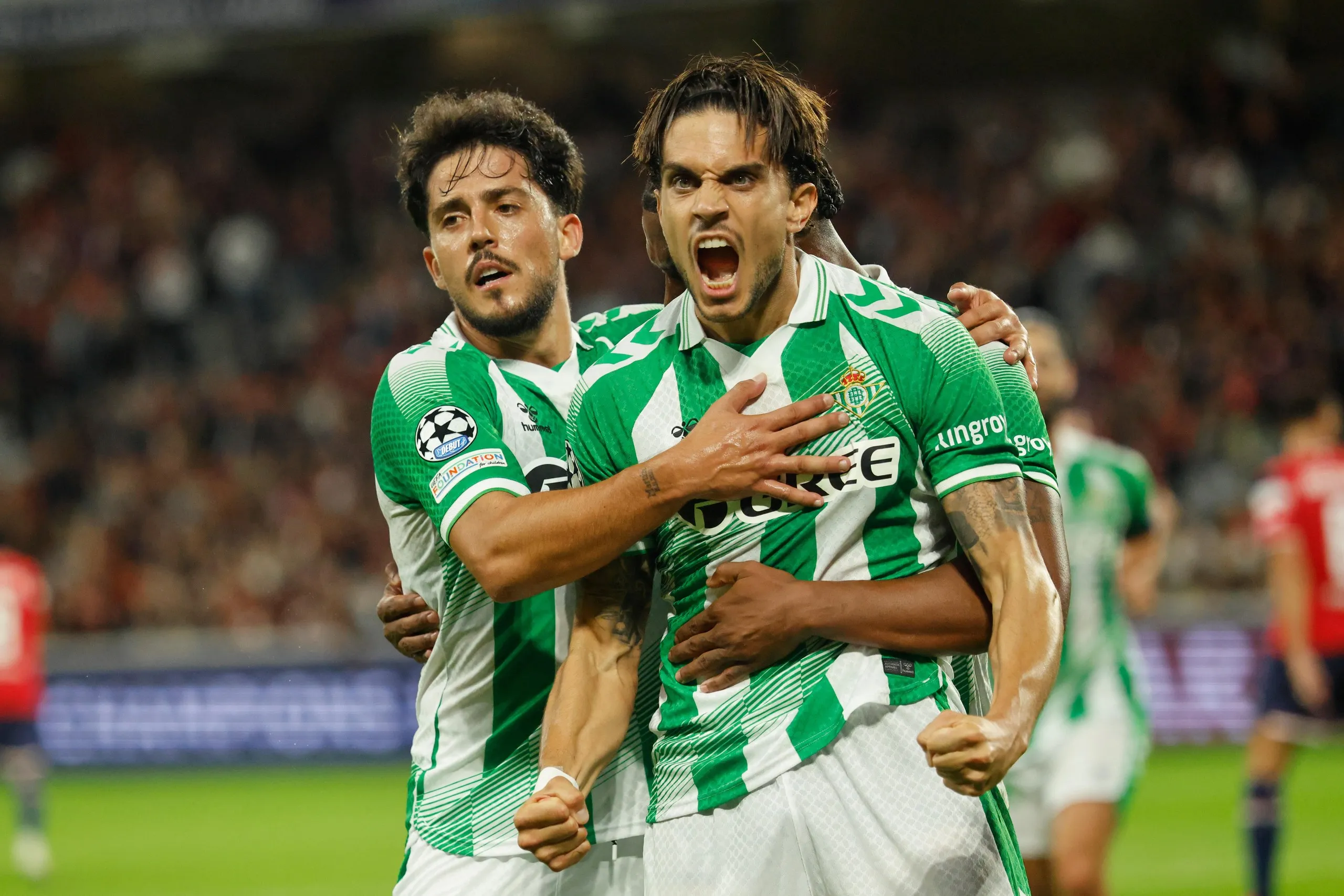 Real Betis' Marc Bartra celebrates after scoring his side's equaliser at Lille.