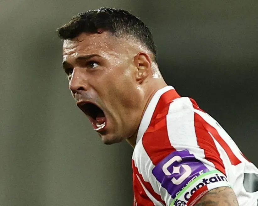 Granit Xhaka screams at a referee. 