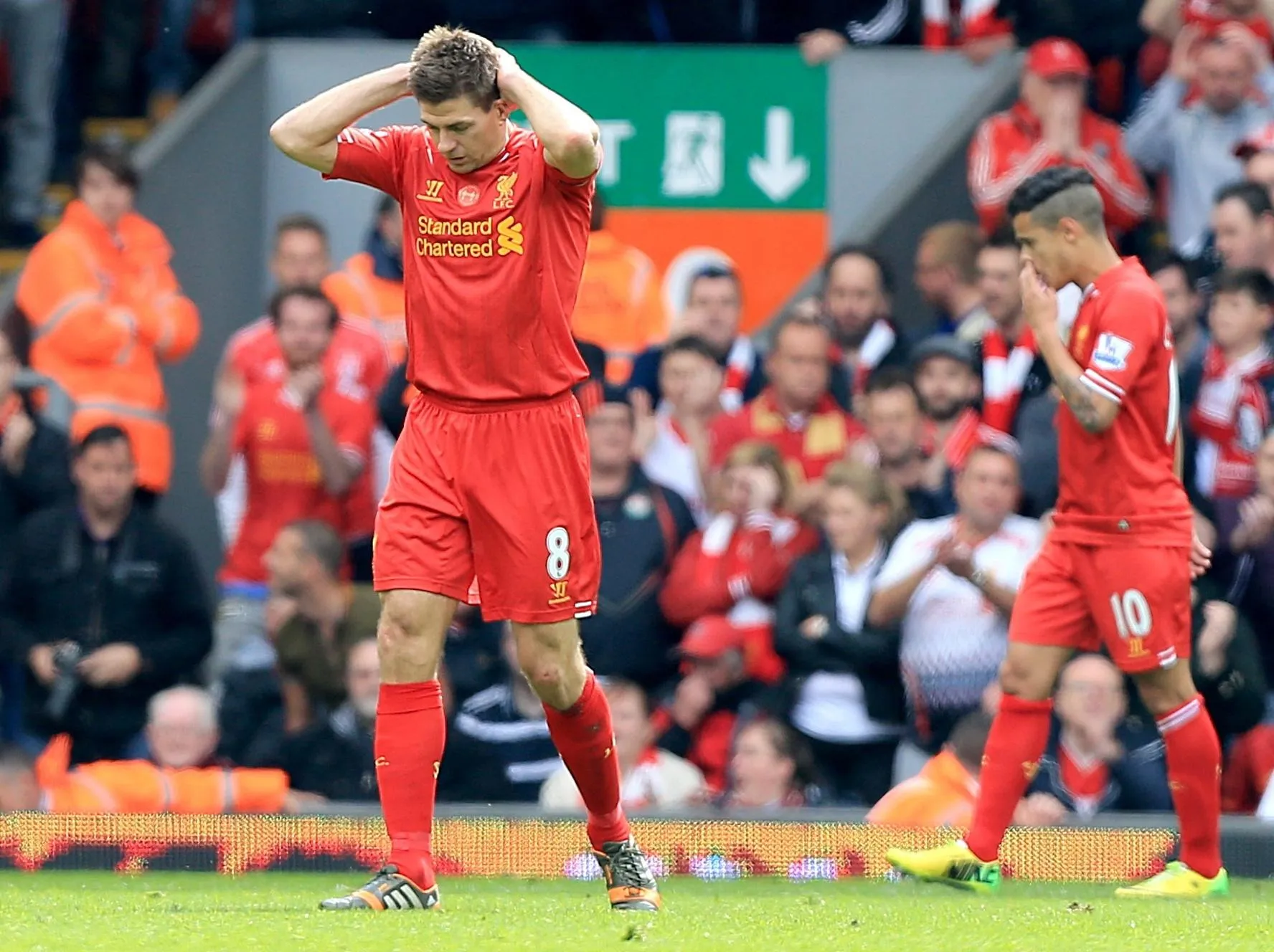 Liverpool’s Steven Gerrard (left) puts his hands on his head after his mistake against Chelsea in 2014.