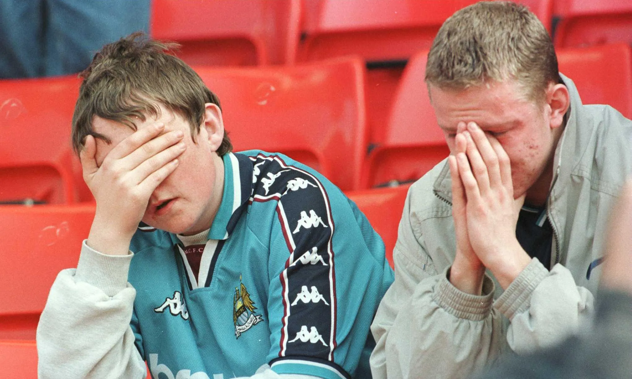 Manchester City fans after watching their team win at Stoke but still get relegated in May 1998.