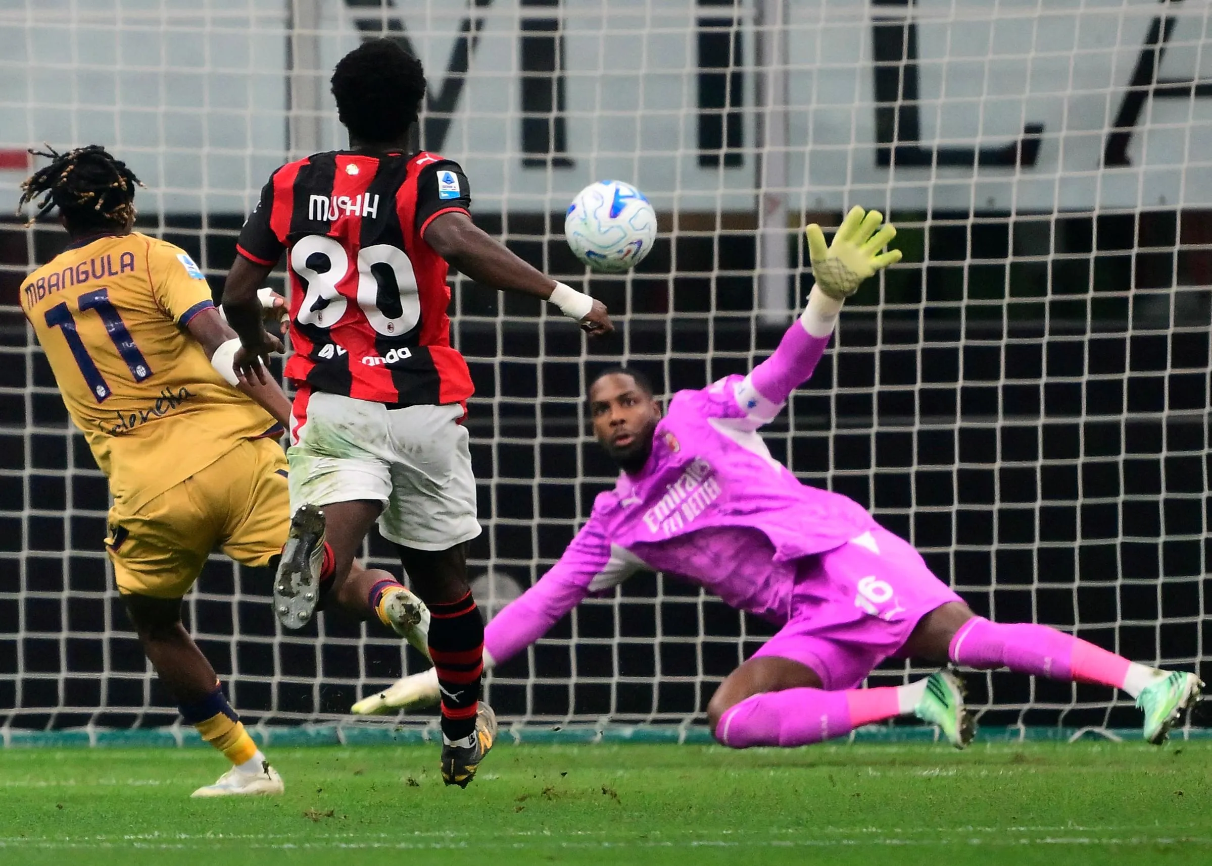 Samuel Mbangula seals his hat-trick as Milan goalkeeper Mike Maignan grasps at the air in vain