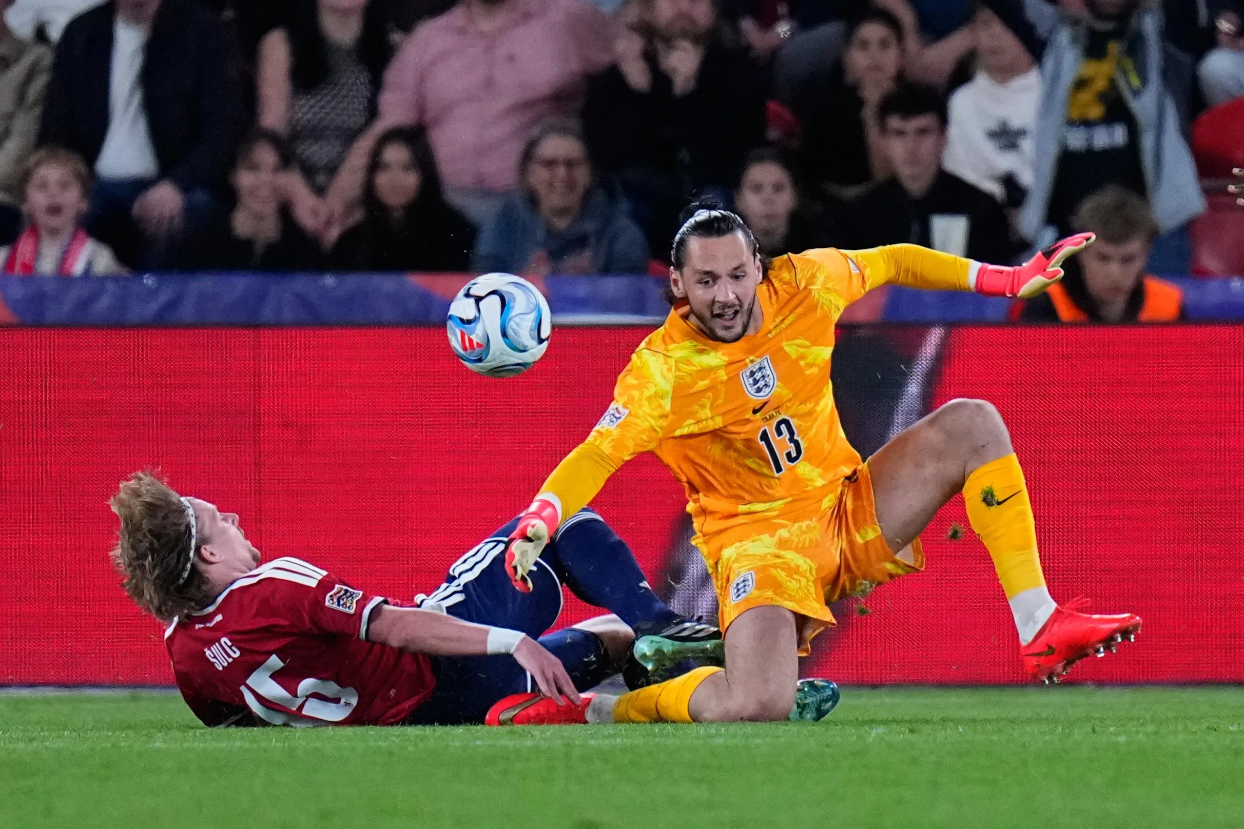 James Trafford collides with a player