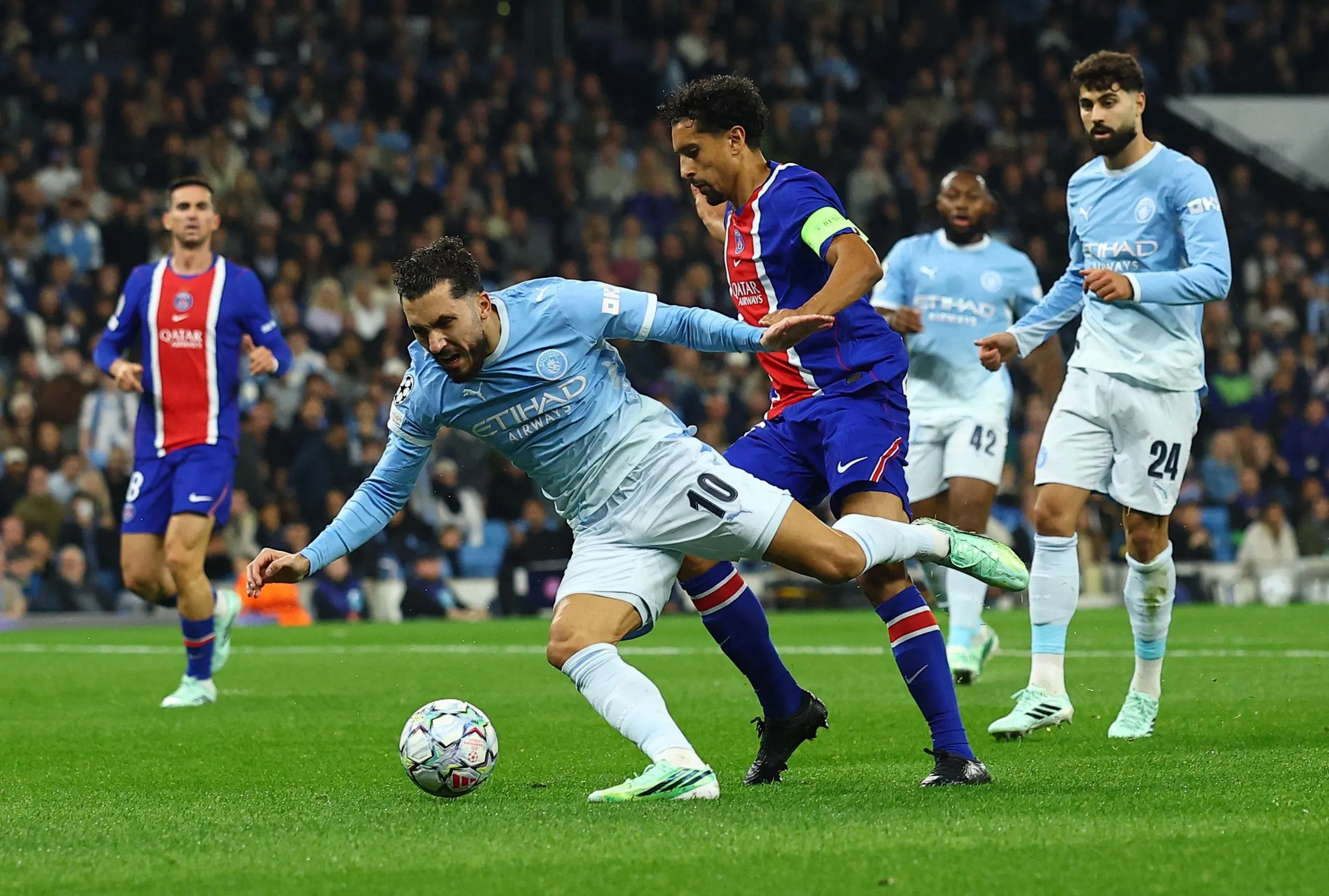 Rayan Cherki goes down in the box after contact from Marquinhos. No penalty, says the ref.
