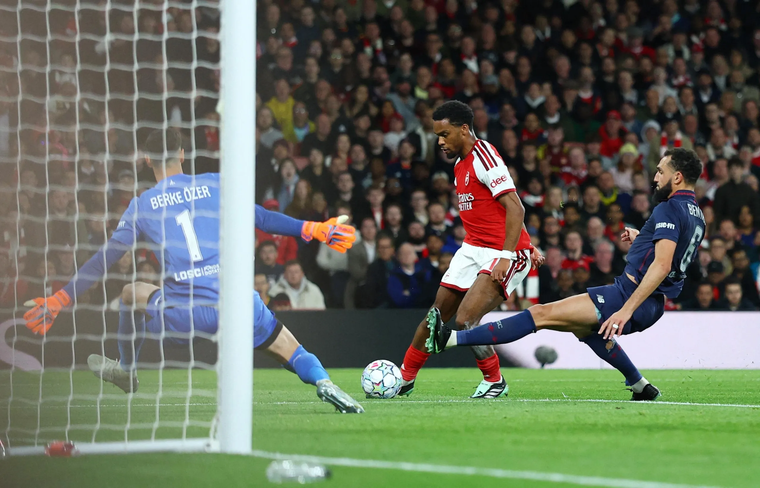 Arsenal's Jurrien Timber scores their first goal past Lille's Berke Ozer.