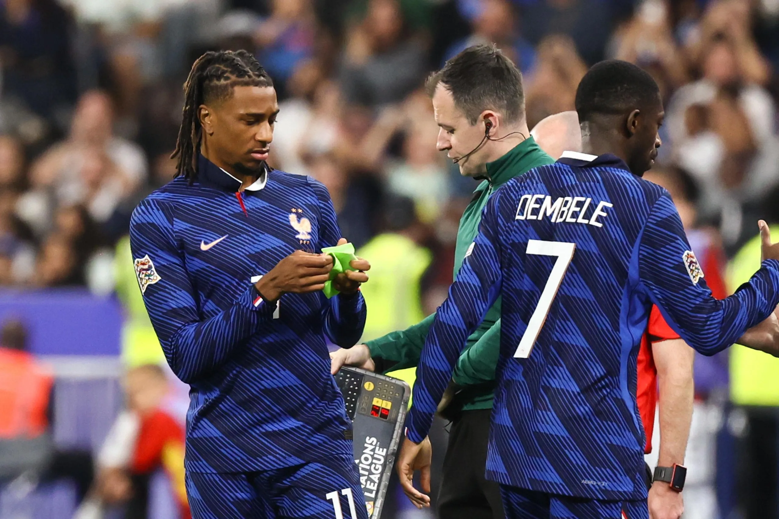 Michael Olise looked confused after being given the armband.