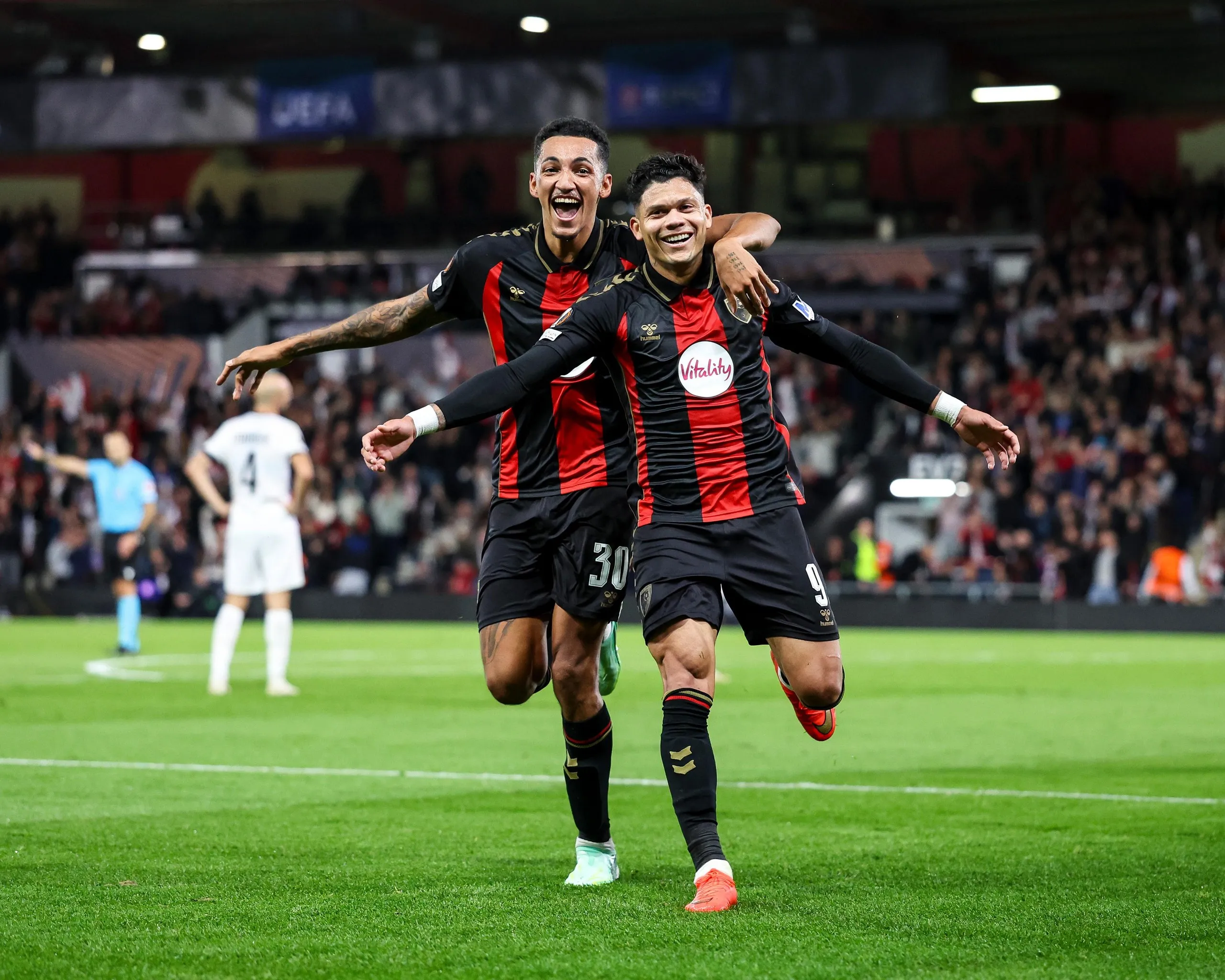 Evanilson of Bournemouth celebrates with Álvaro Rodríguez