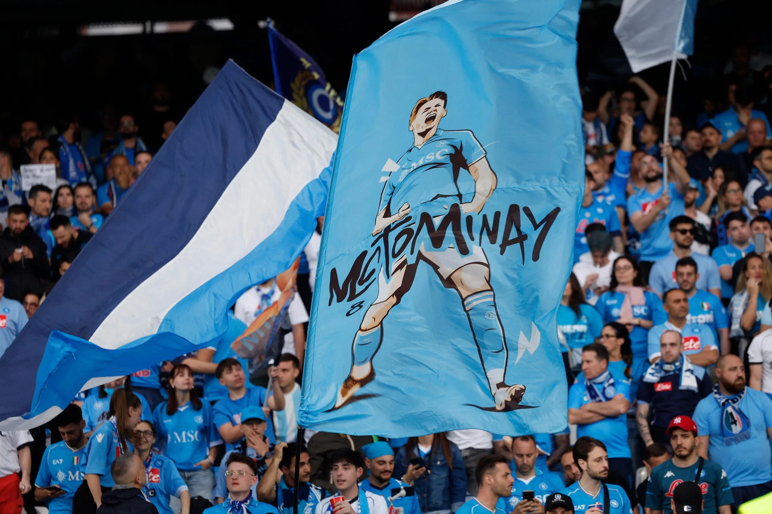 Napoli fans fly a Scott McTominay flag in the Stadio Diego Armando Maradona.