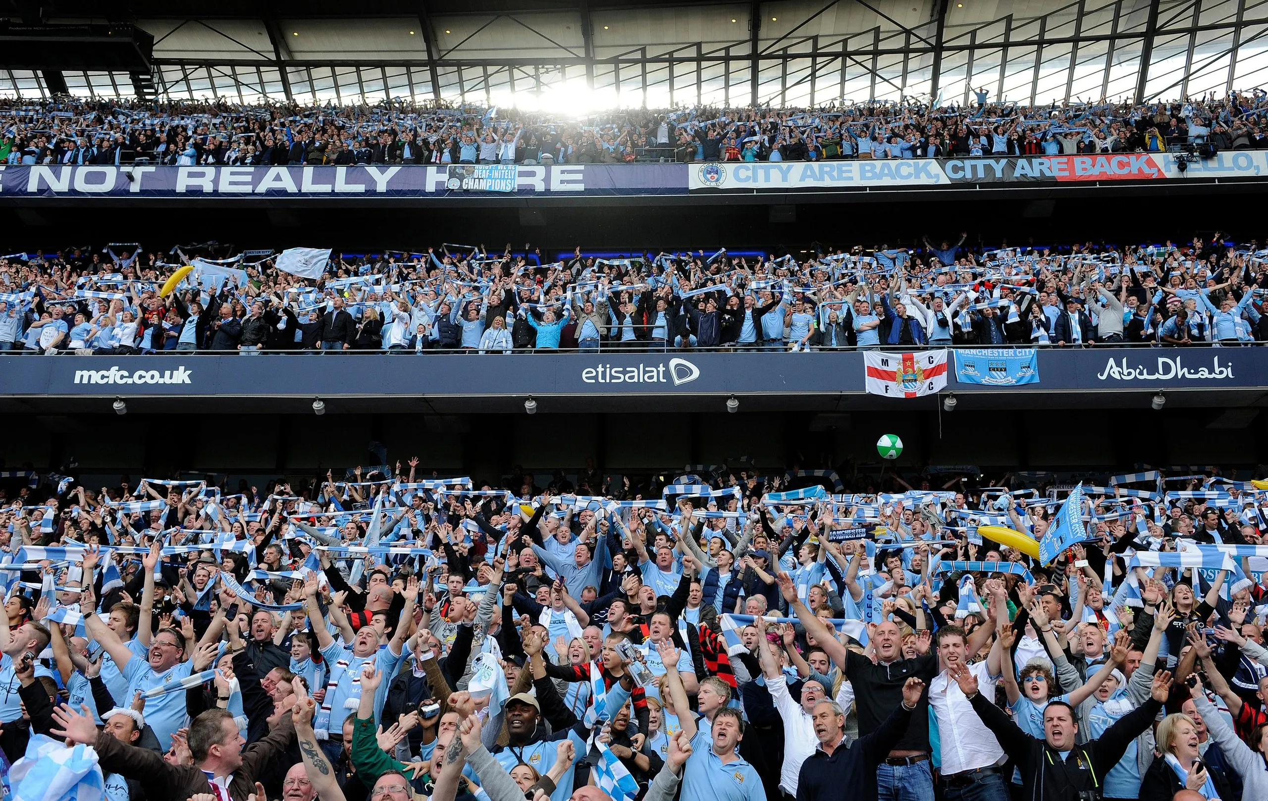 Manchester City fans celebrate winning the title shortly after the final whistle against QPR in 2012.