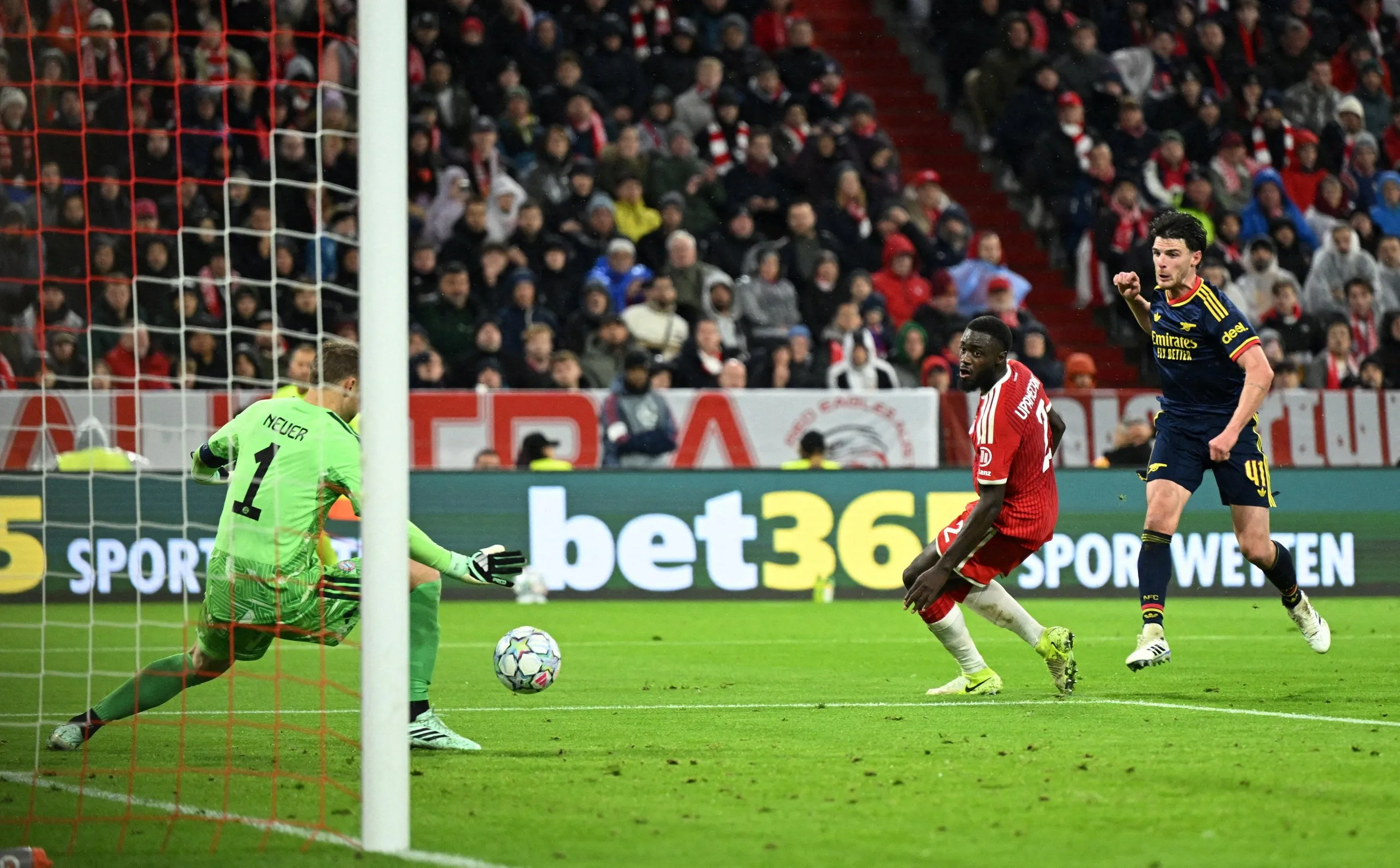 Declan Rice shoots past the Bayern Munich goalkeeper to score.