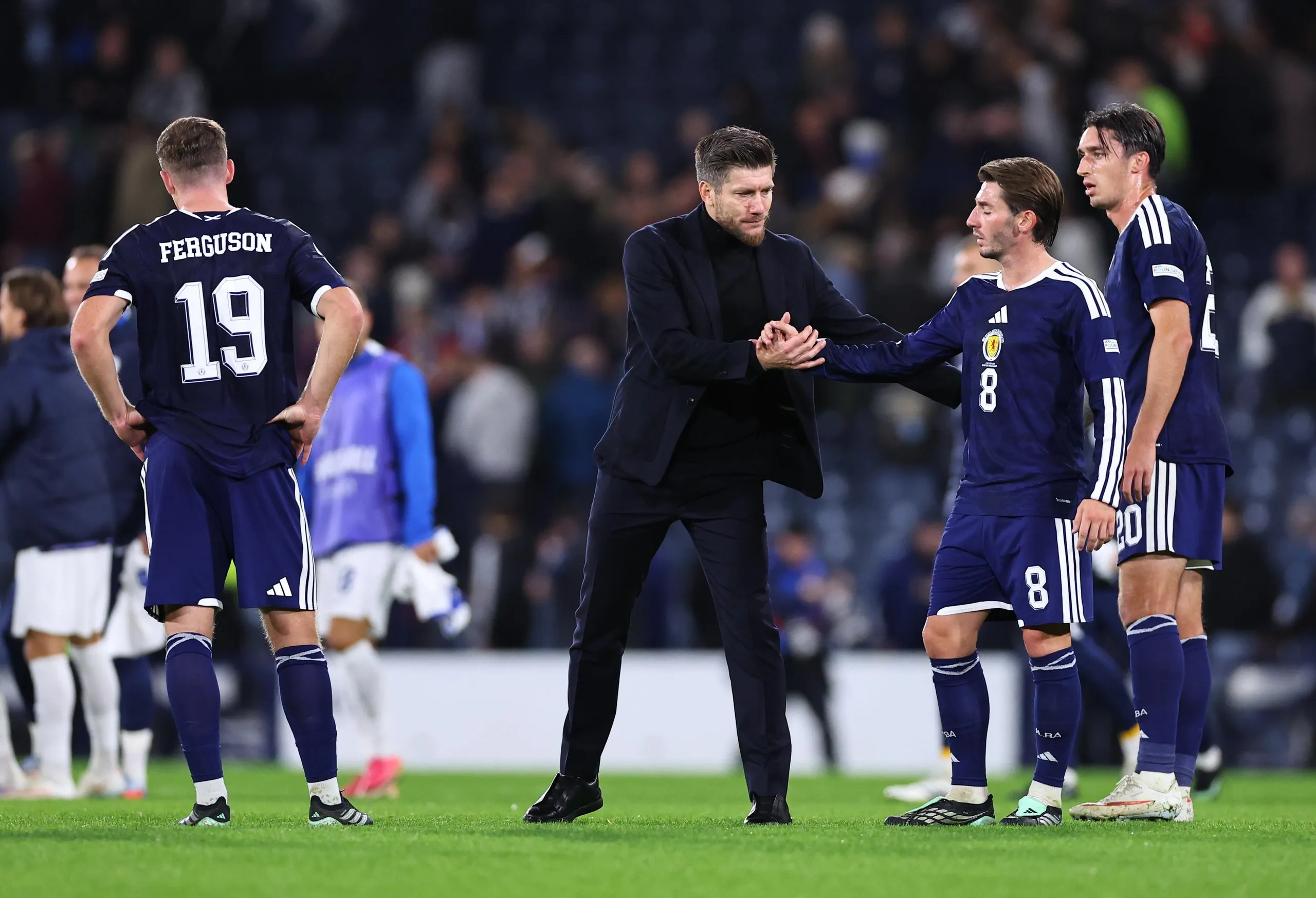 Sébastien Pocognoli consoles Billy Gilmour after Scotland’s feeble defeat at home against Slovenia on Tuesday.