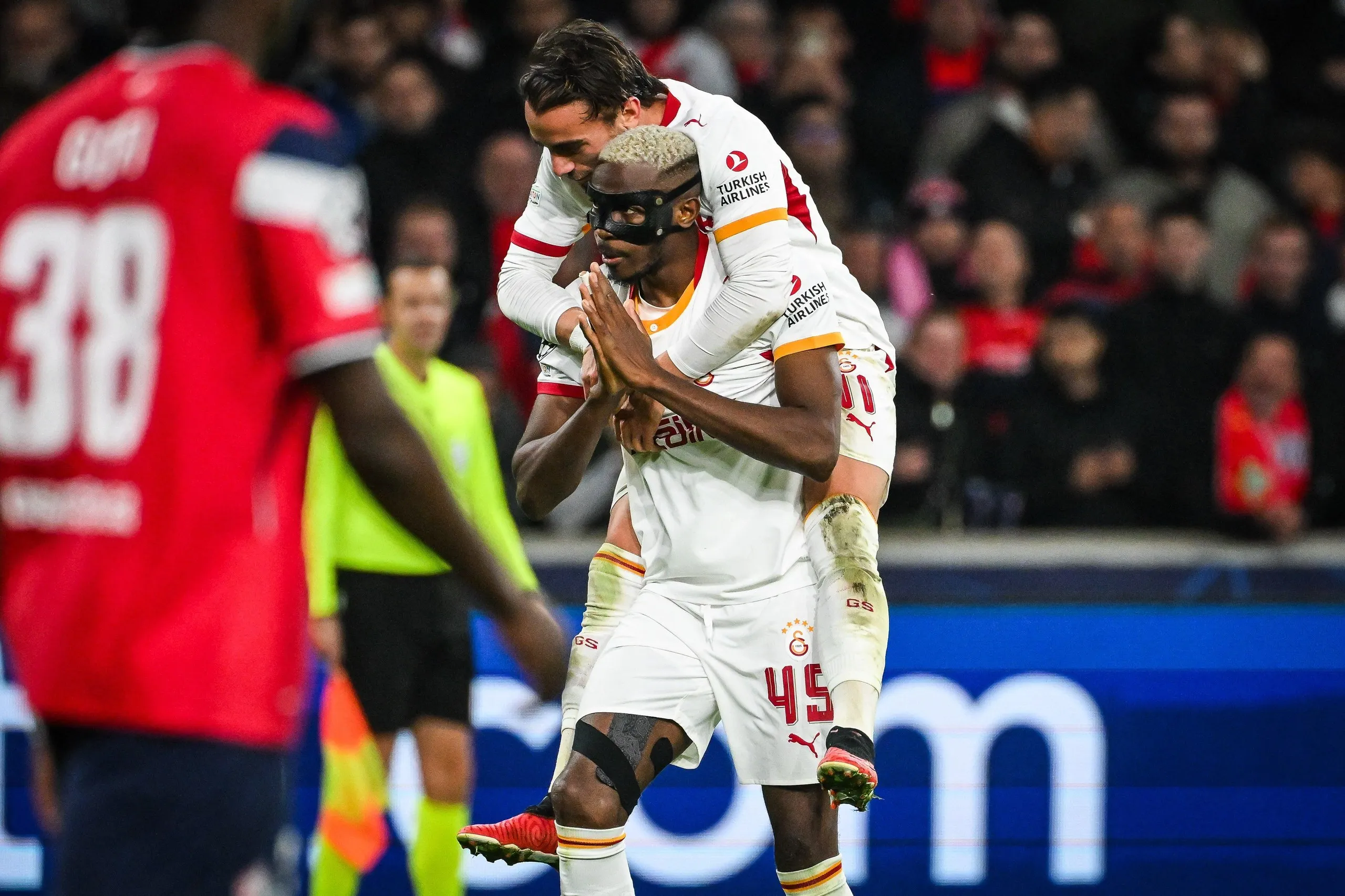 Victor Osimhen, with Yunus Akgun on his shoulders, after rounding off Galatasaray’s 4-2 win at Lille