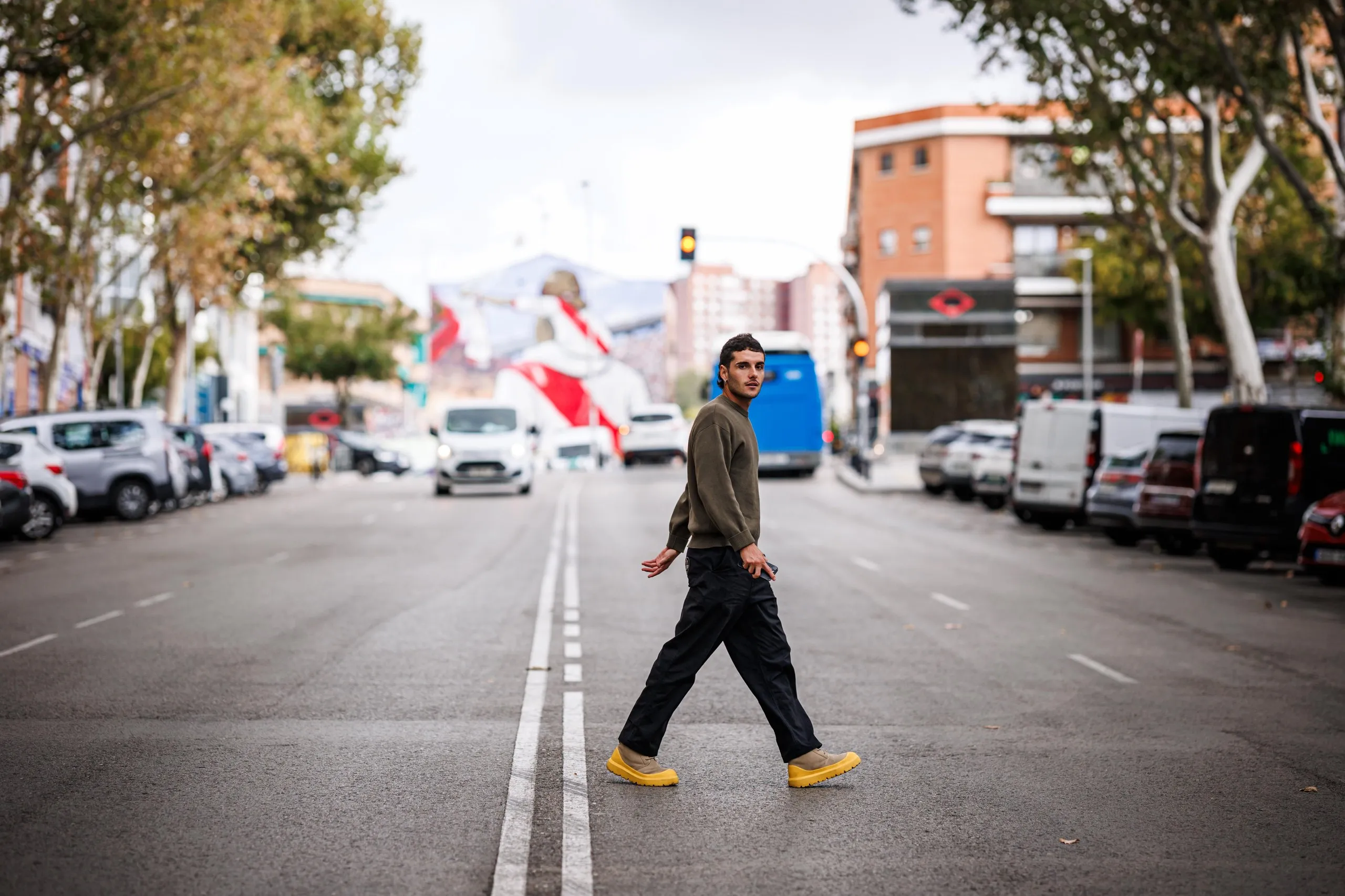 Sergio Camello crosses the road by the Rayo Vallecano stadium