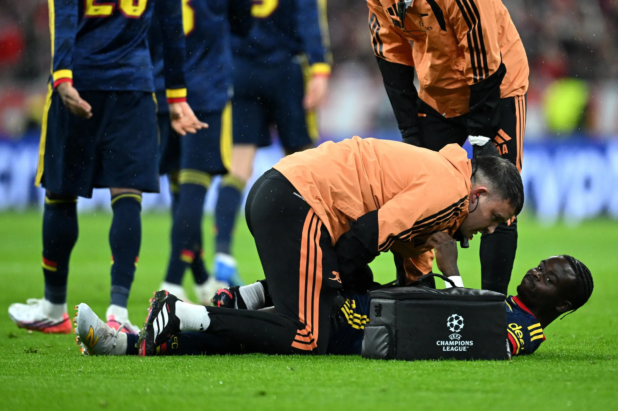 Bukayo Saka receives treatment after going down injured early on