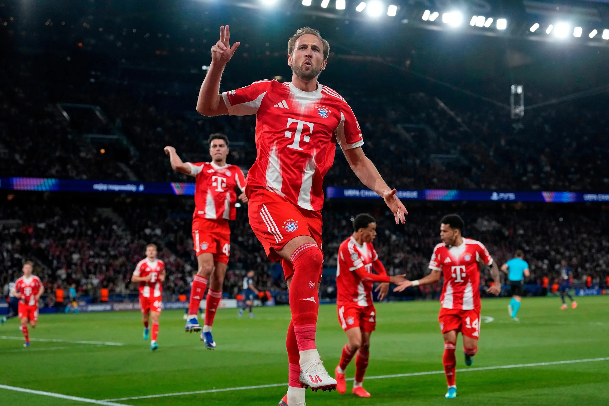 Harry Kane celebrates with raised fingers after scoring a penalty for Bayern Munich